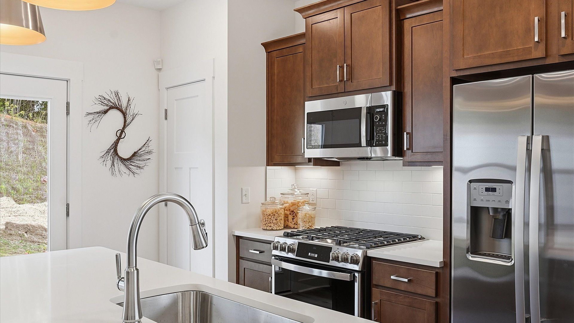 Tasteful kitchen with a center island and stylish pendant lighting—crafted to high standards located at Marion Square