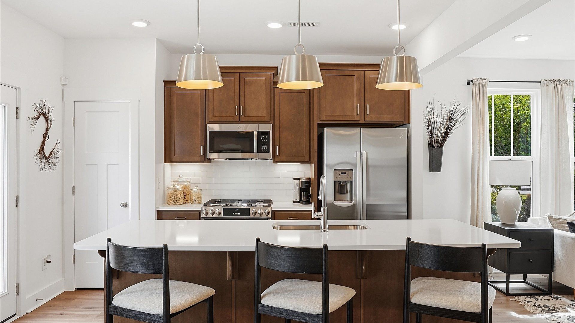 Exceptional kitchen featuring a spacious island, eye-catching pendant lights, and modern finishes near Downtown Greenville