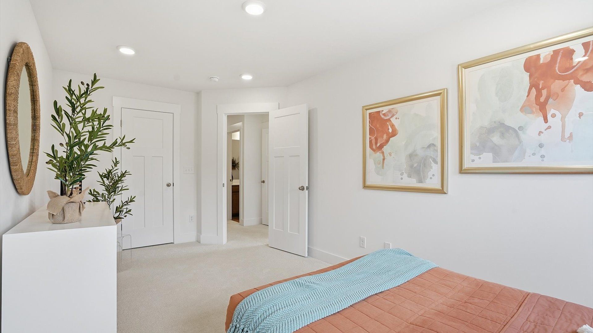Accomplished bedroom layout with cozy carpet, a spacious walk-in closet, and tasteful decor located in Greenville, SC