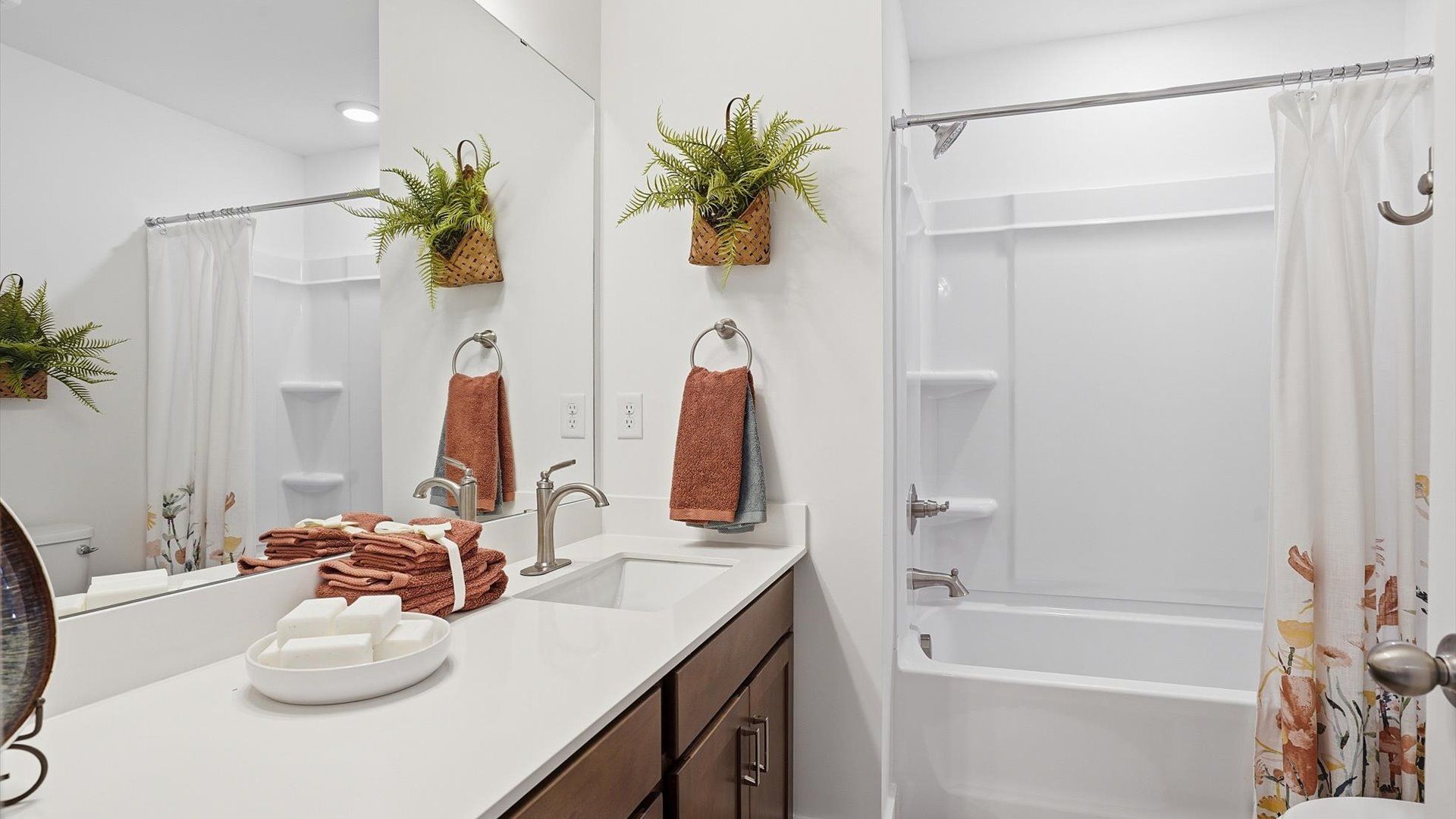 Top-notch bathroom with current fixtures, tasteful materials, and elevated charm at the Marion Square community