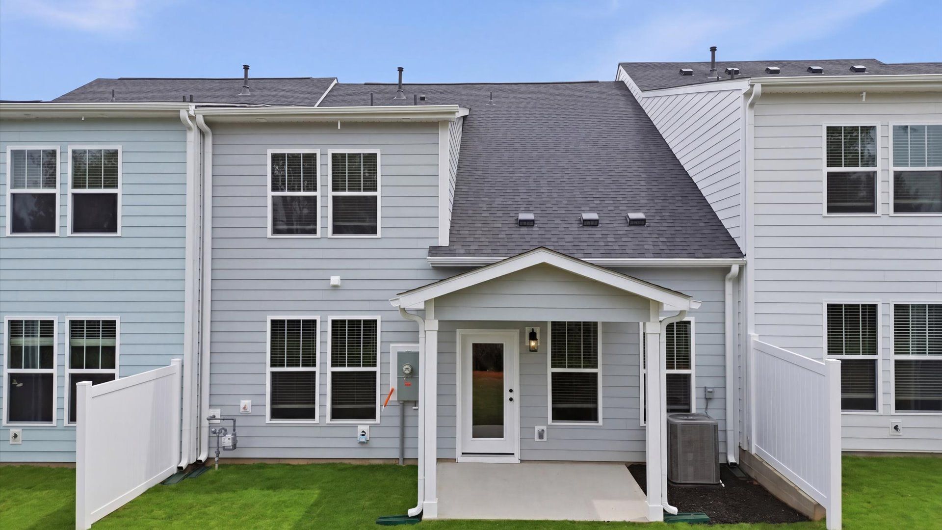 Vibrant rear outdoor space featuring a covered porch and exceptional craftsmanship located in Anderson, SC