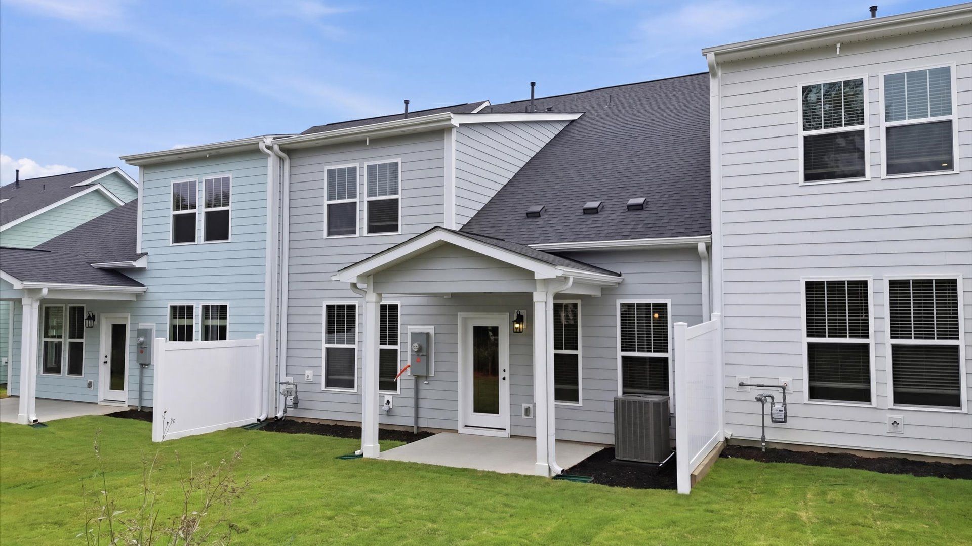 Established charm meets functional outdoor living with a spacious rear covered porch located at Village at Midway
