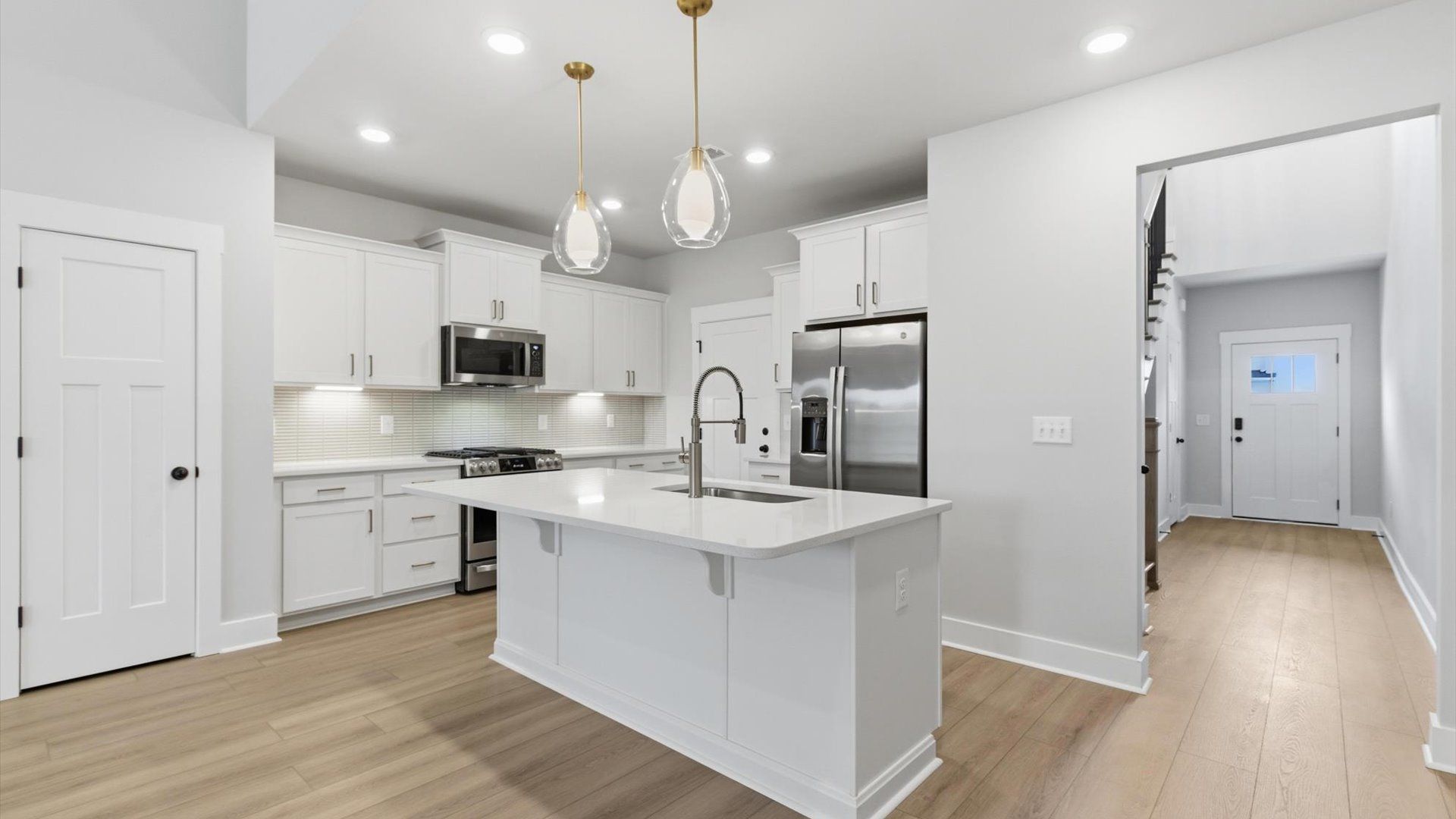 Superior craftsmanship shines in this modern kitchen with a space-saving island and open flow in Anderson, SC