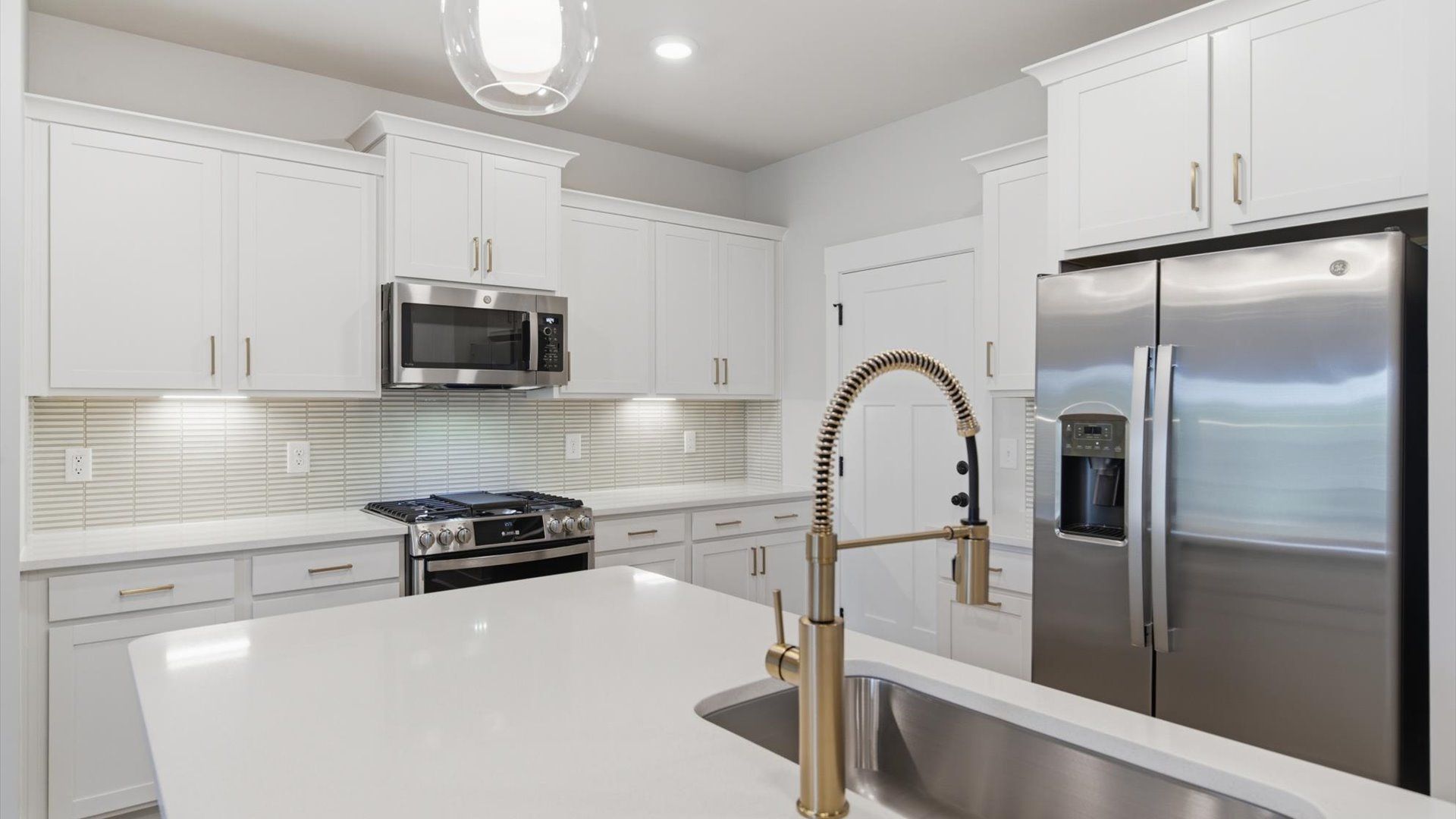 Elegant kitchen with modern finishes in this first-class villa at Village at Midway near Downtown Anderson, SC