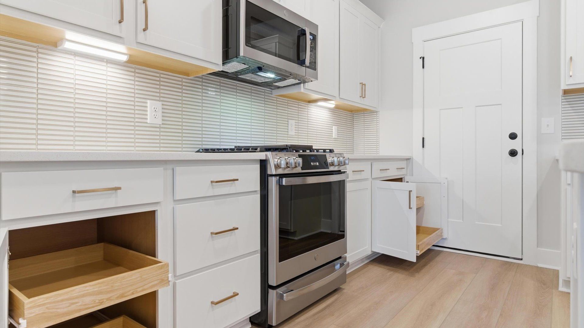 Tasteful kitchen with abundant storage and modern finishes in a first-class DRB Homes design