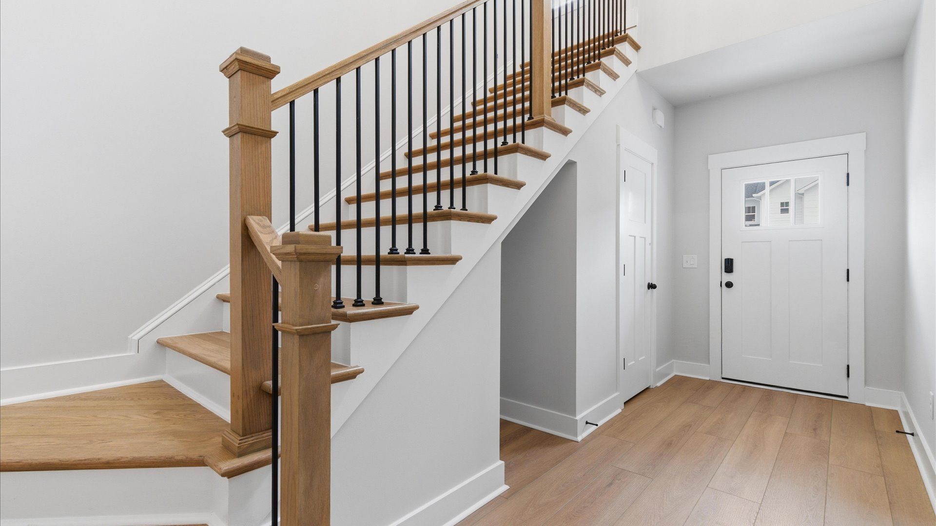 Memorable arrival experience with hardwood floors and elegant trim in the foyer in Anderson, SC