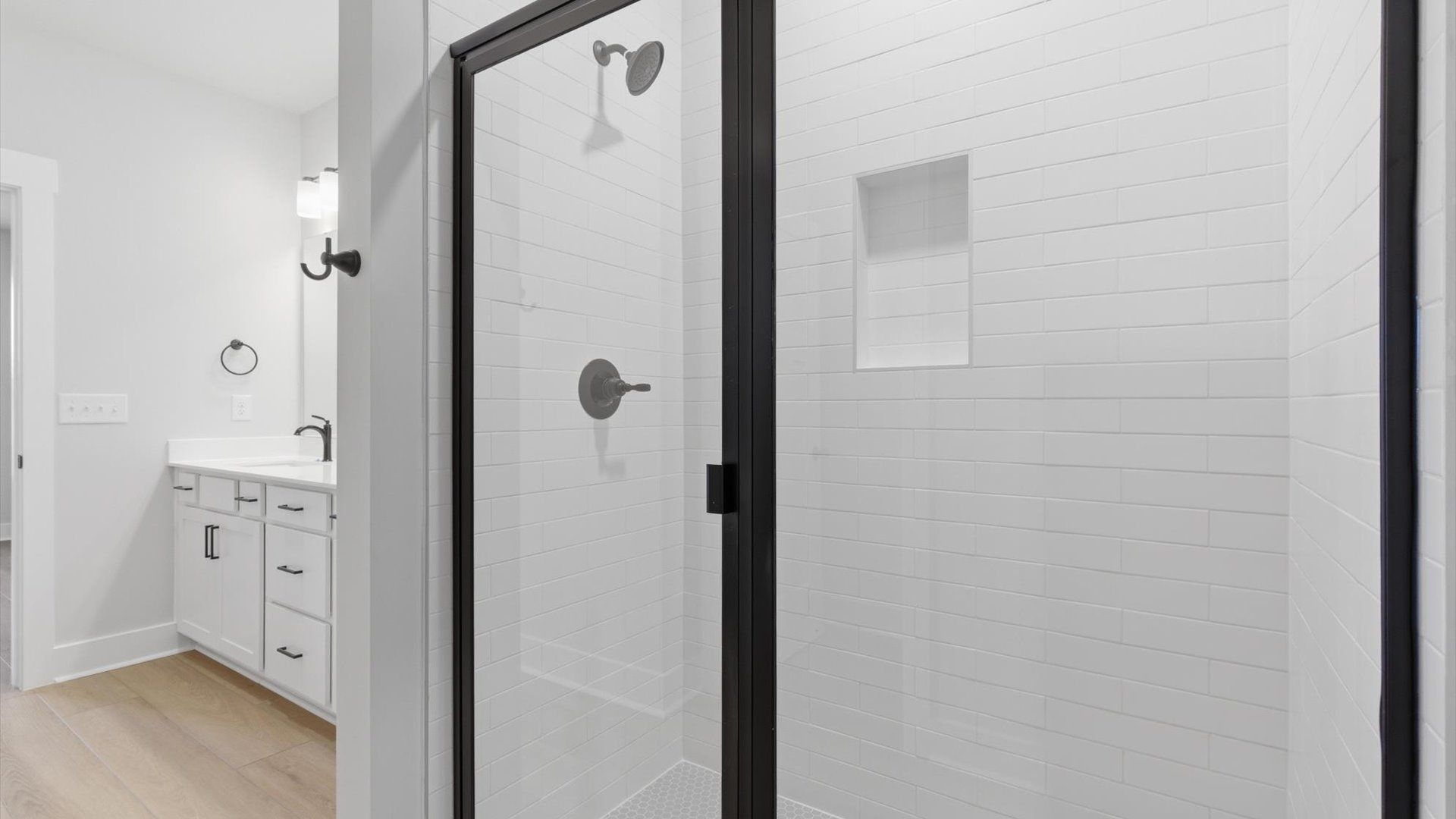 Notable primary bath featuring dual vanity, walk-in shower, and tasteful design touches throughout in Anderson, SC