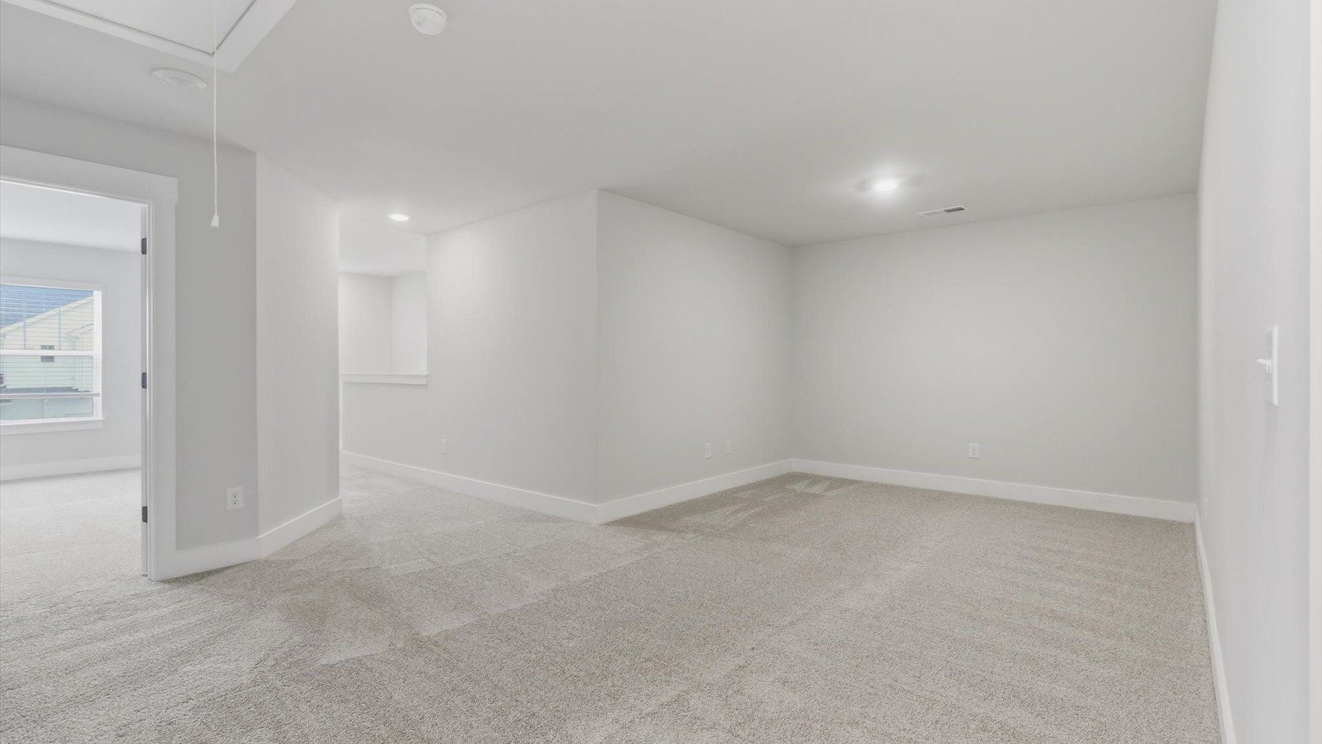 Stylish loft retreat with carpeted flooring and accomplished architectural detail at the Village at Midway community