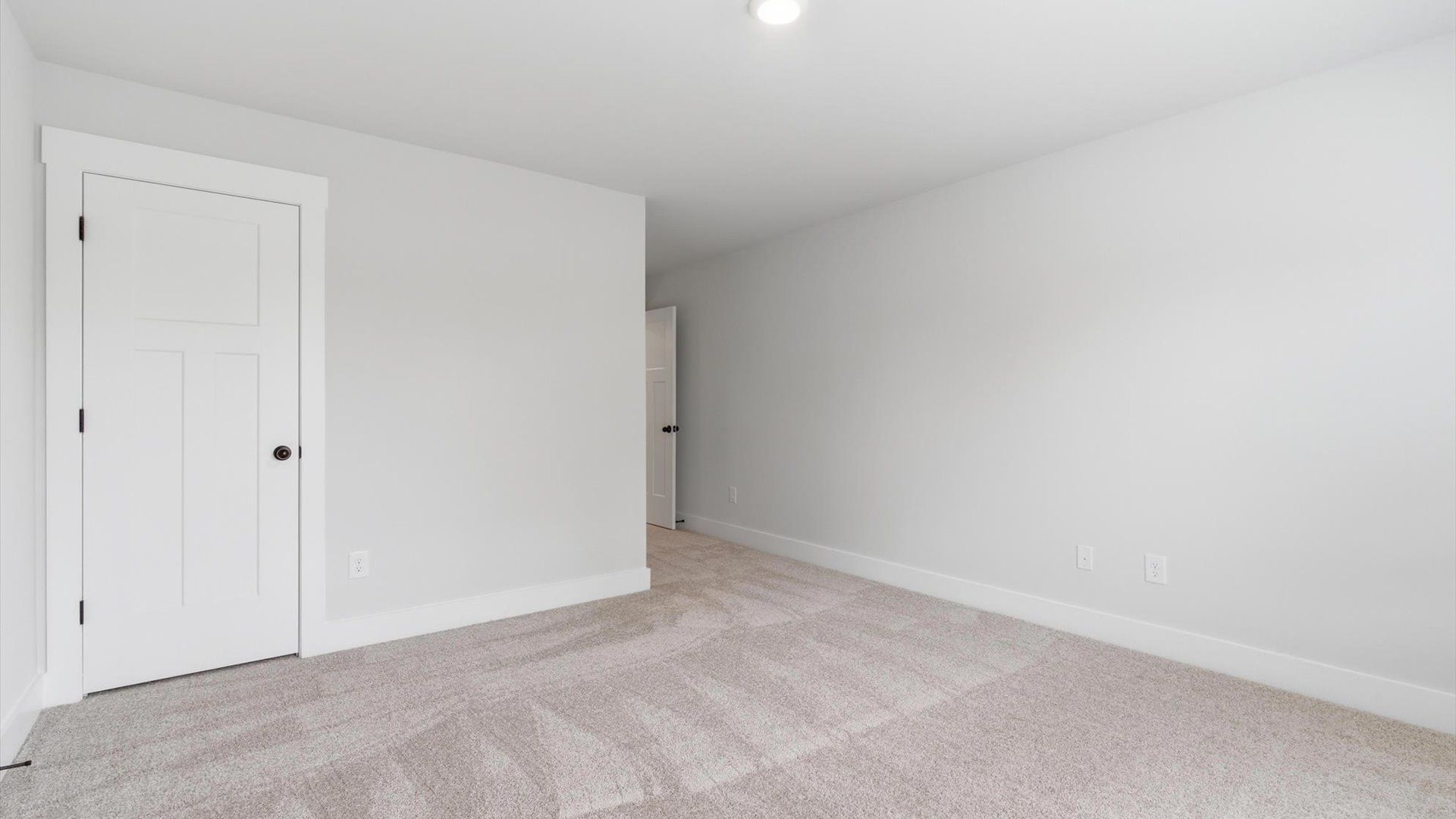 First-rate secondary bedroom with a spacious walk-in closet and elegant carpeted flooring located in Anderson, SC