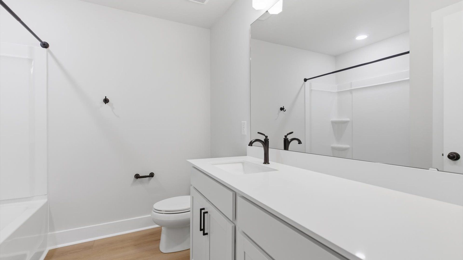 Top-notch bathroom with current fixtures, tasteful materials, and elevated charm at the Village at Midway community