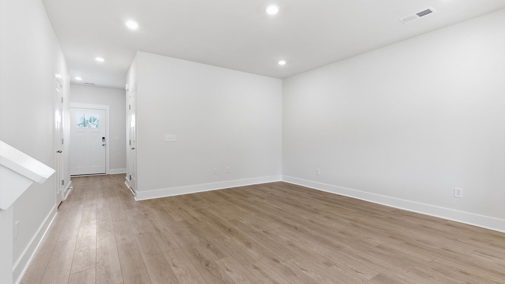 Hardwood flooring and high standards define this vibrant family room ideal for everyday living in Simpsonville, SC