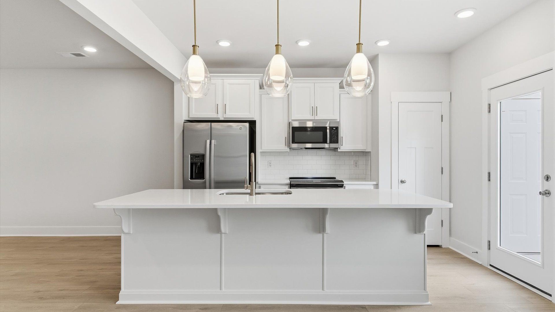 First-class finishes and a thoughtfully scaled island highlight this elegant kitchen space located at Gresham Station