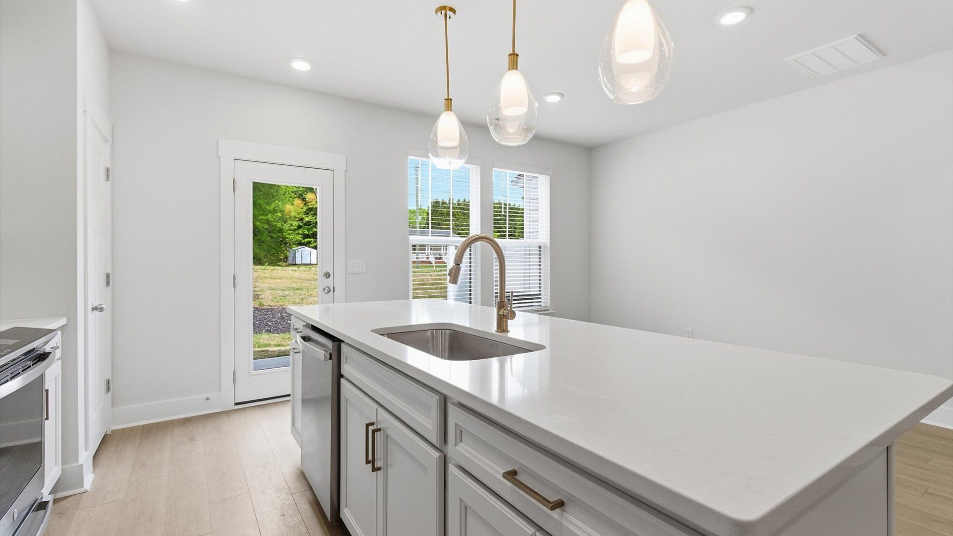 Well-designed kitchen with a center island and tasteful finishes that elevate everyday living