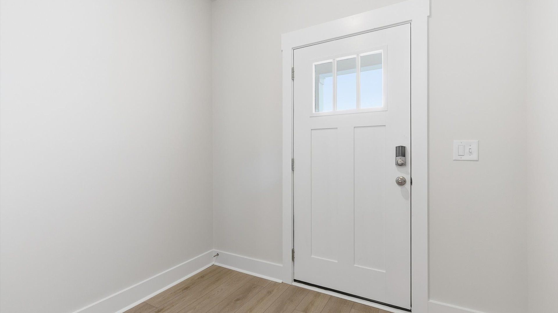 Stylish foyer with hardwood flooring and tasteful architectural detail in a superior layout located at Gresham Station