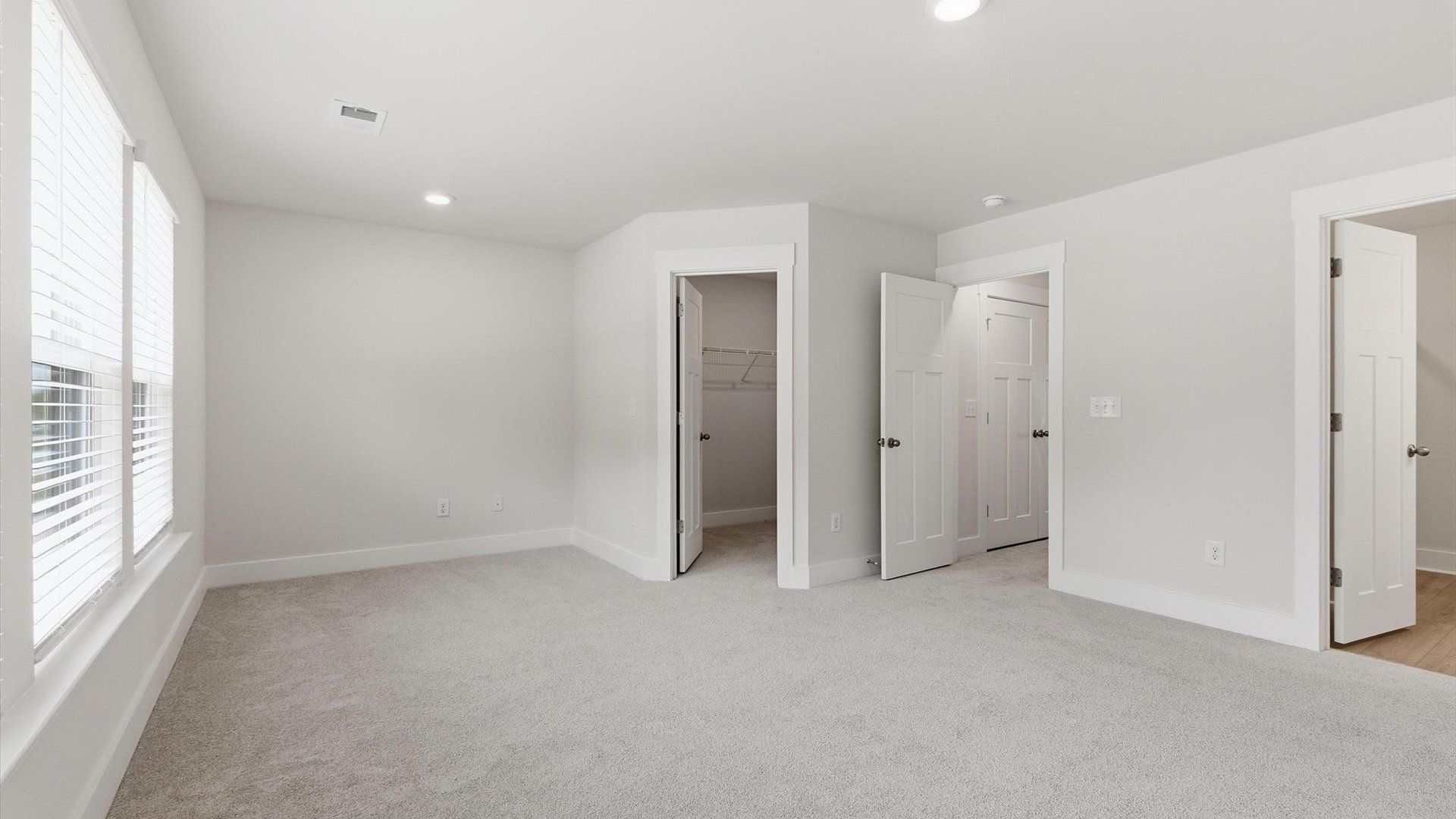 Primary suite that offers first-rate relaxation with established style and elevated finishes