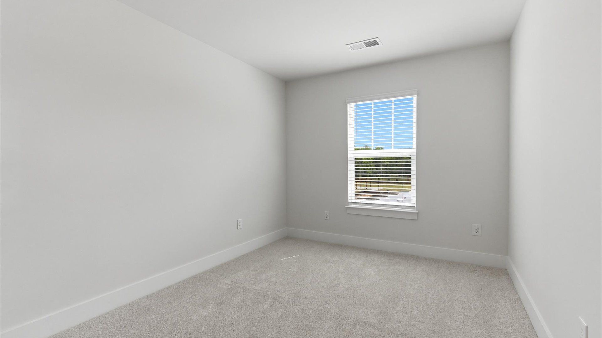 Inviting bedroom with tasteful finishes and a large window that creates a fresh, open ambiance located at Gresham Station