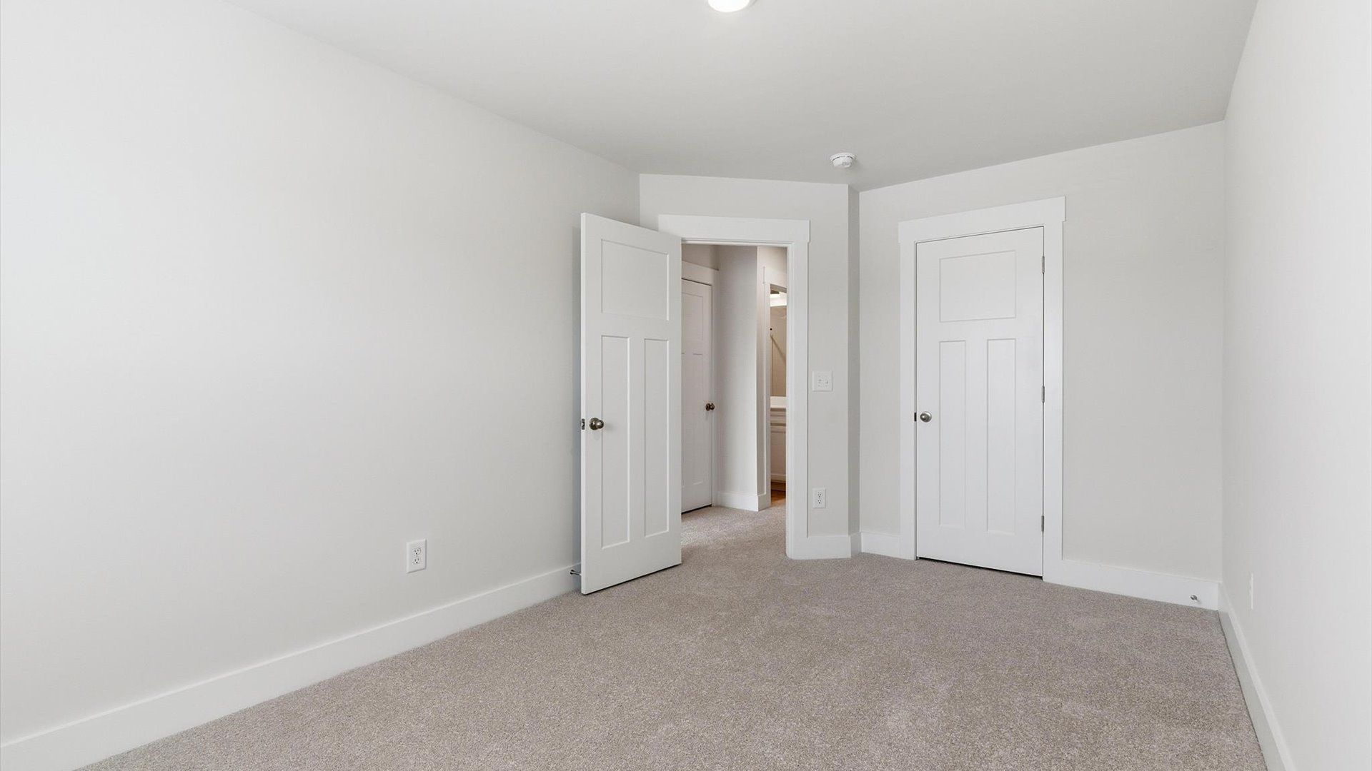 Notable secondary bedroom offering cozy carpeted flooring and a stylish walk-in closet located in Simpsonville, SC