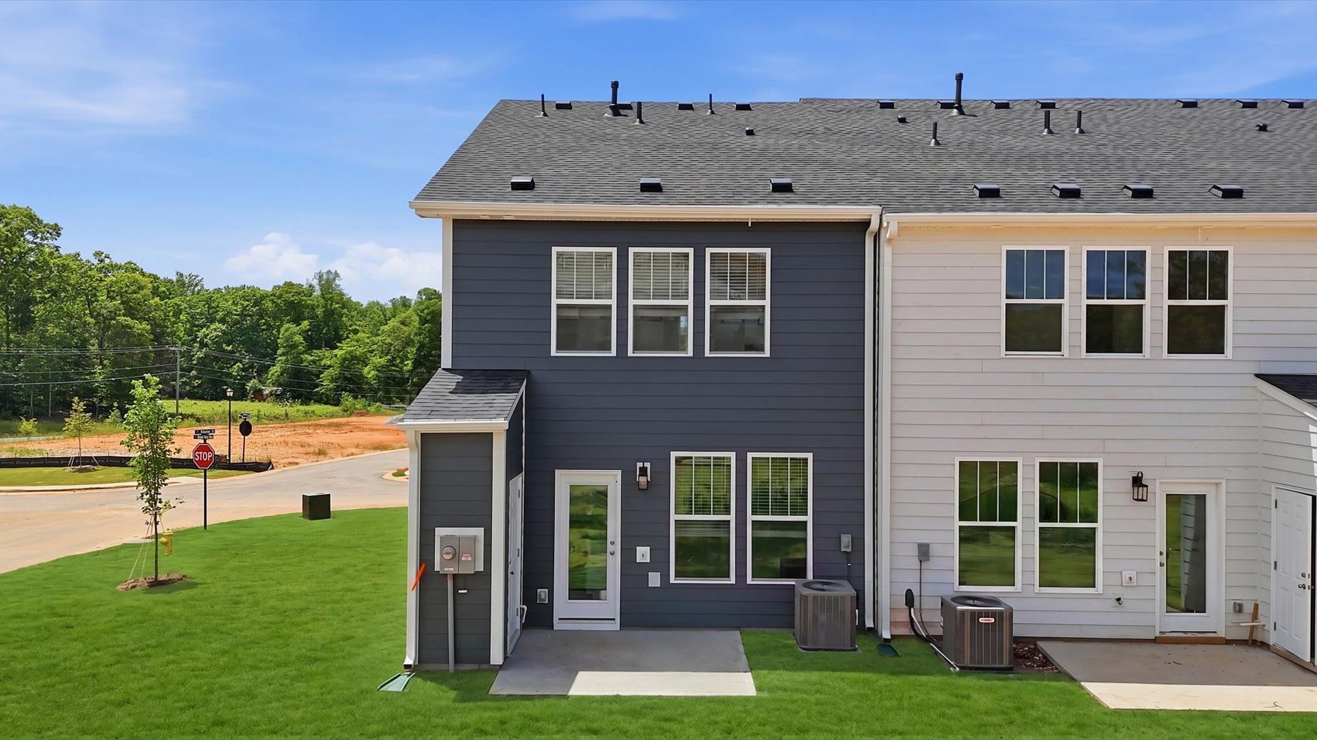 Highly functional backyard with a patio that adds memorable living space to this elegant home in Fountain Inn, SC