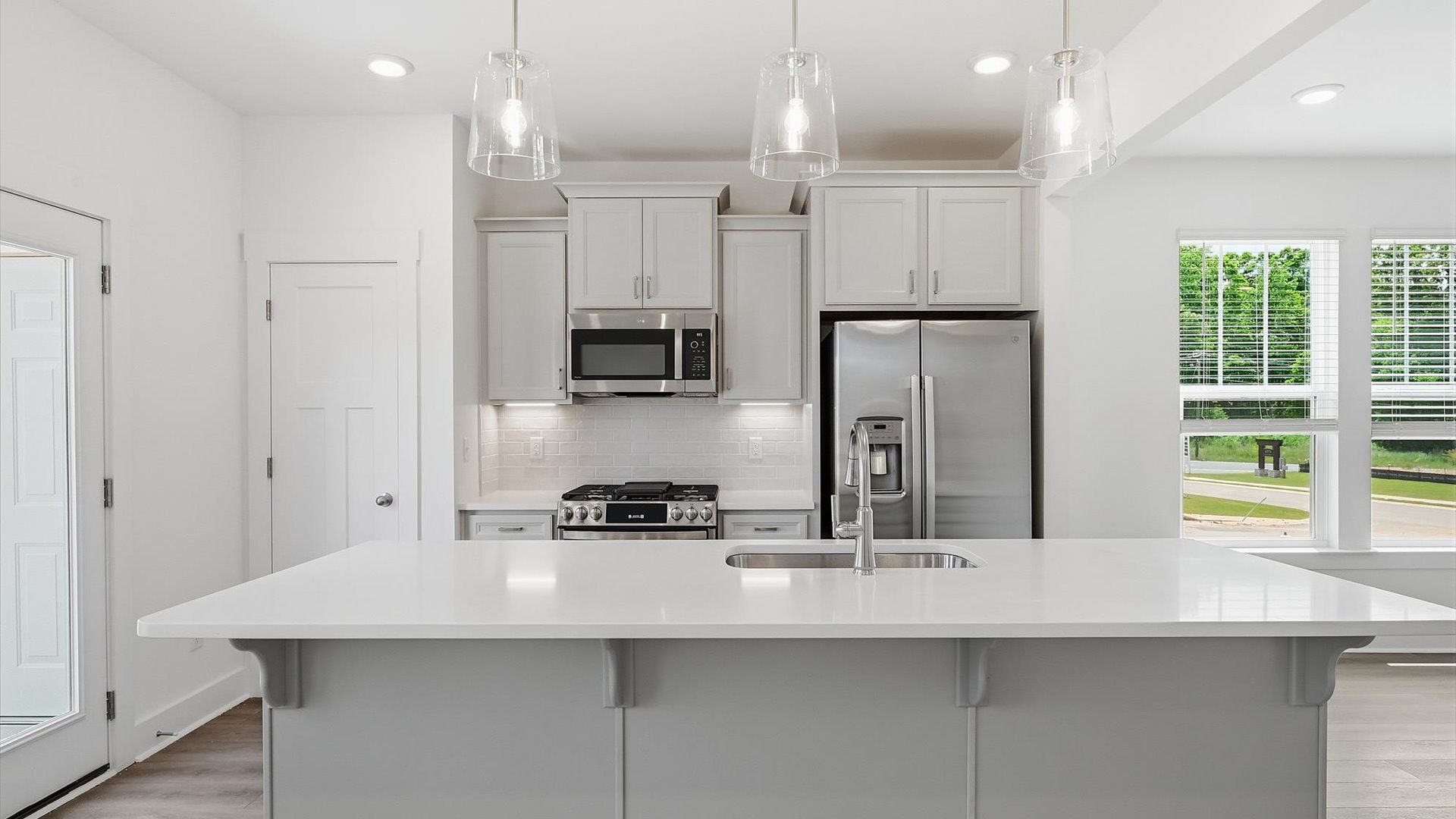 Elegant and compact island anchors this tasteful kitchen with high standards and timeless appeal located in Fountain Inn, SC
