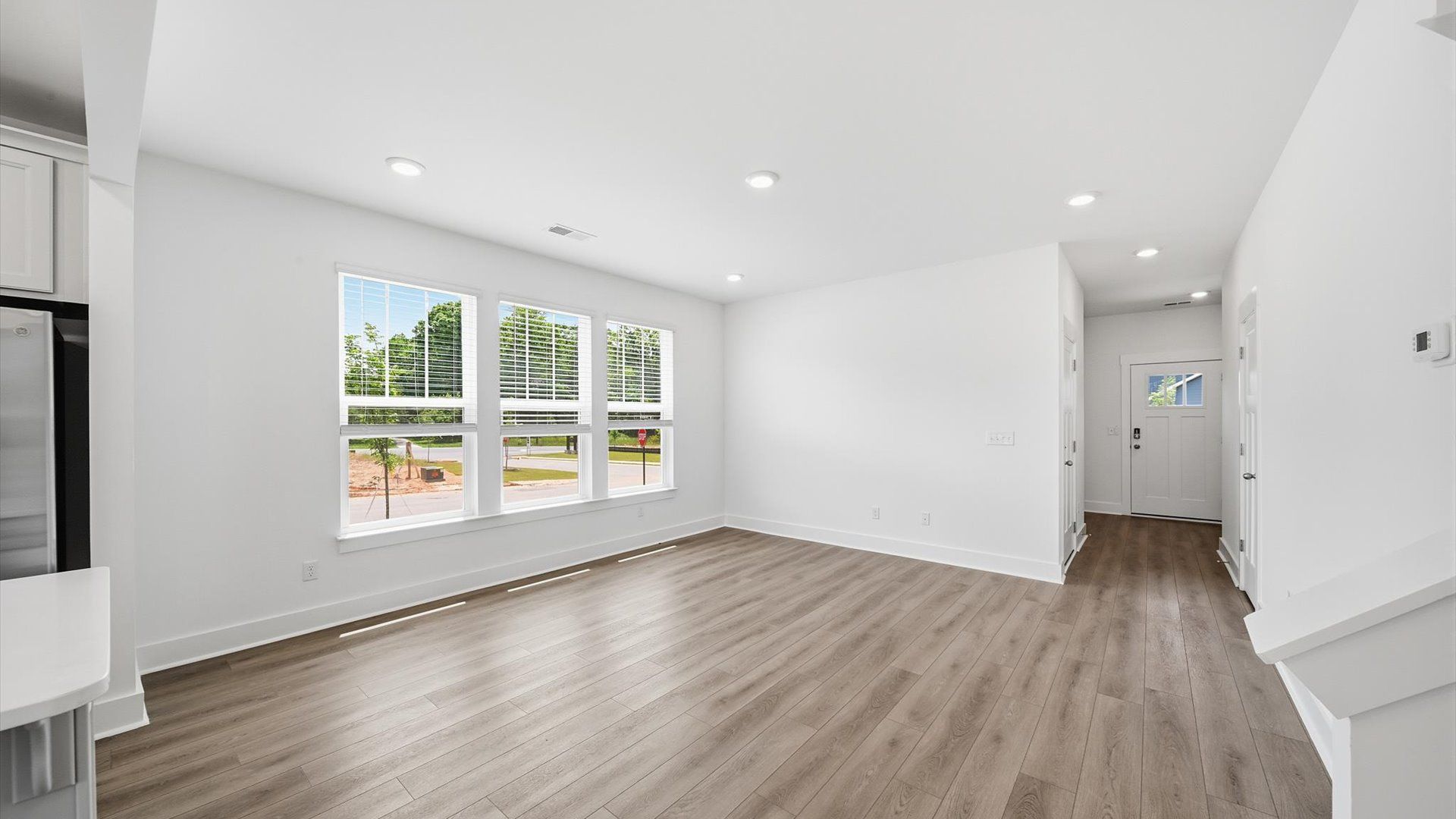 Exceptional family space with hardwood floors and seamless flow to dining and kitchen areas located at Barton Hollow