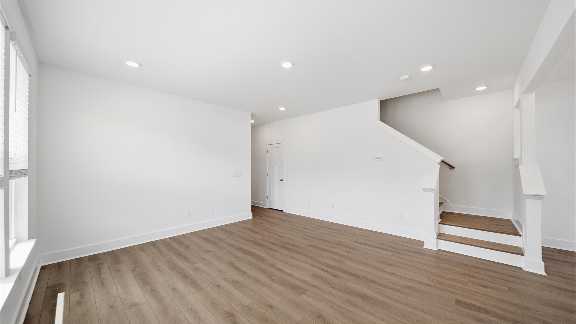 Vibrant and welcoming family room anchored by clean lines, tasteful materials, and abundant light in Fountain Inn, SC