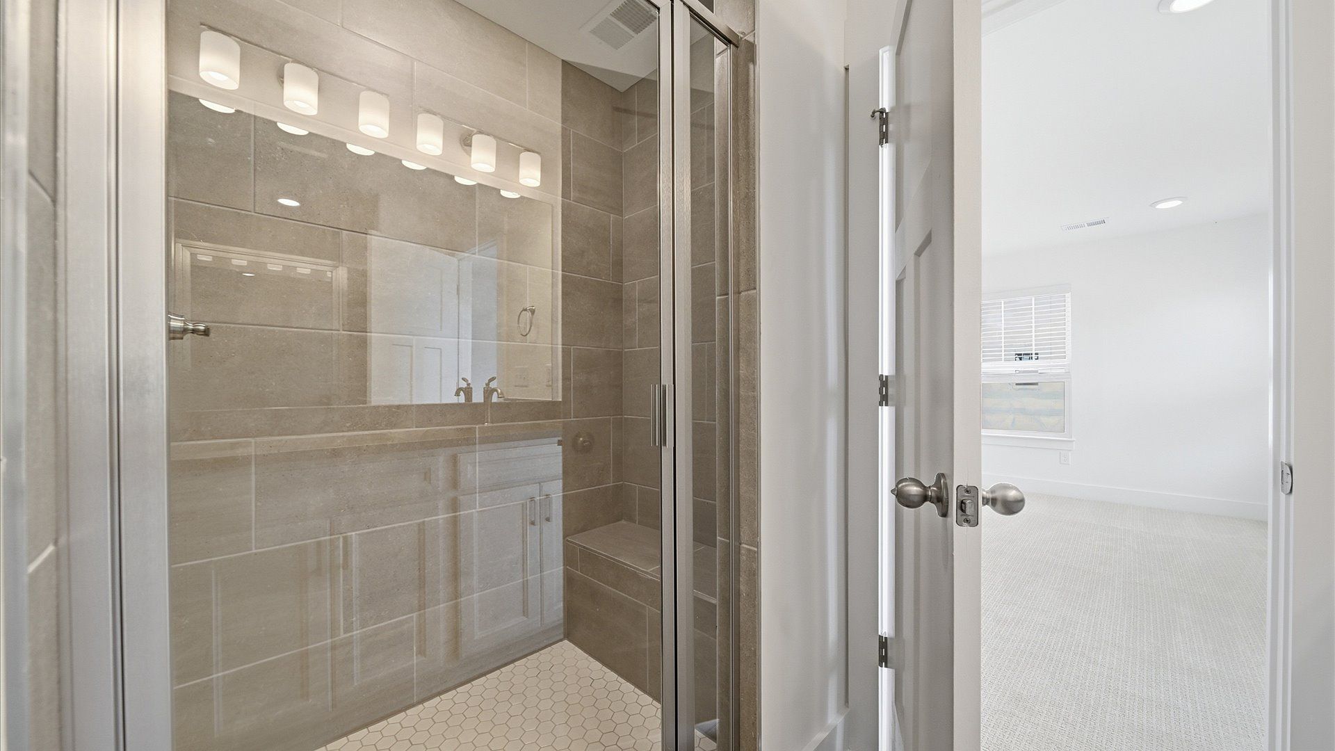 Tasteful primary bath with modern finishes, a walk-in shower, and thoughtful double vanity layout at Barton Hollow