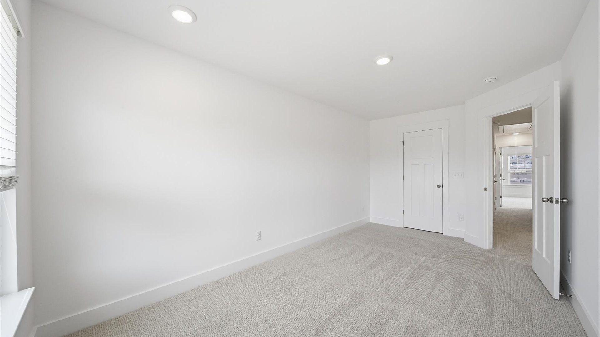Elegant bedroom retreat featuring soft carpeting and a thoughtfully designed walk-in closet in Fountain Inn, SC