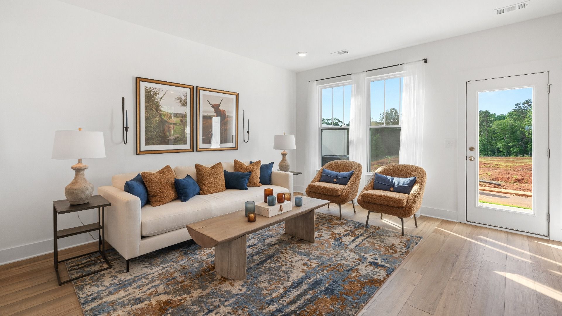 Memorable moments begin in this elegant, open family room with hardwood flooring and refined finishes at Clarke Townes