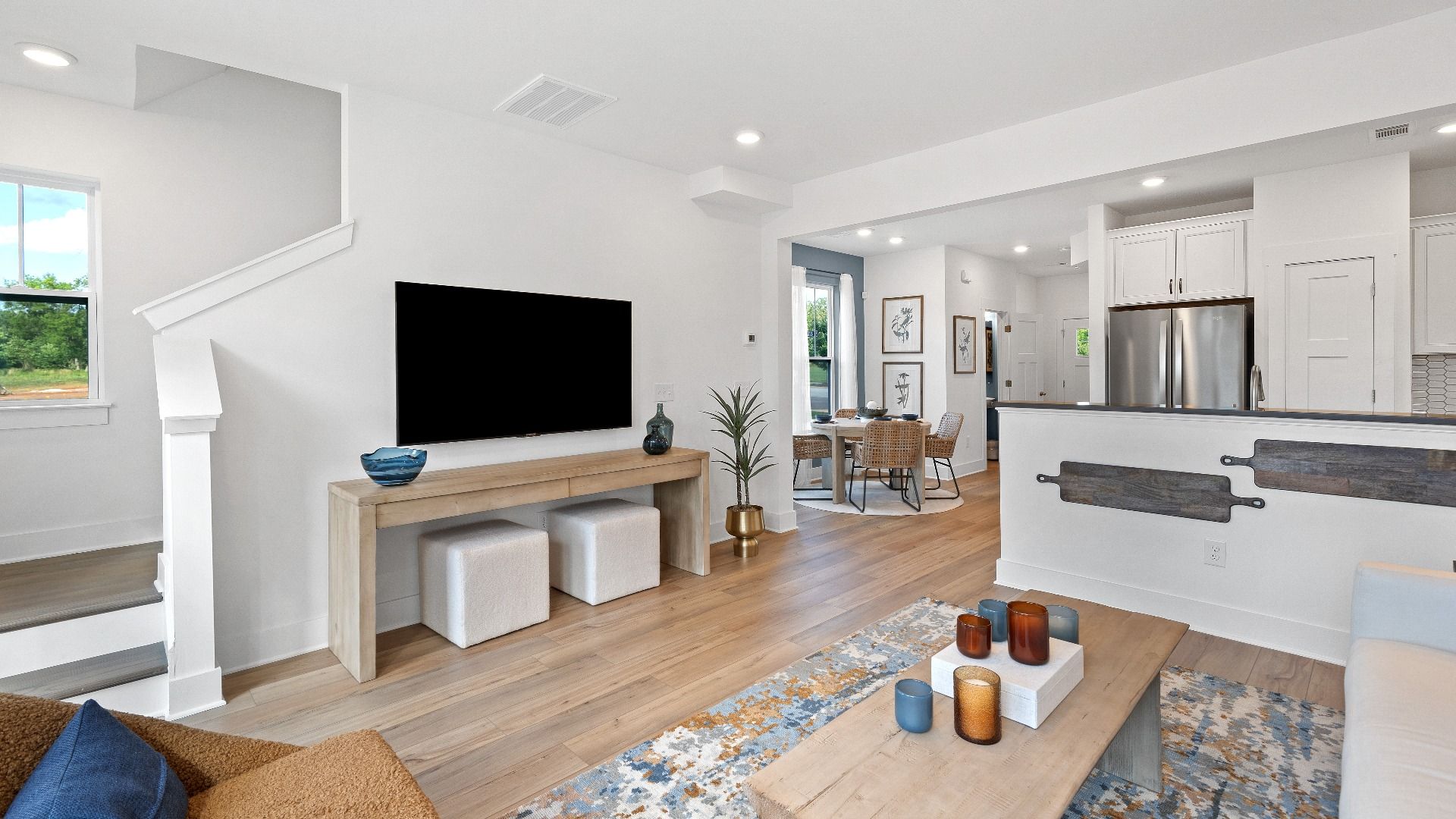 First-rate family room of The Churchill Design with thoughtful layout and superior connection to kitchen and dining spaces