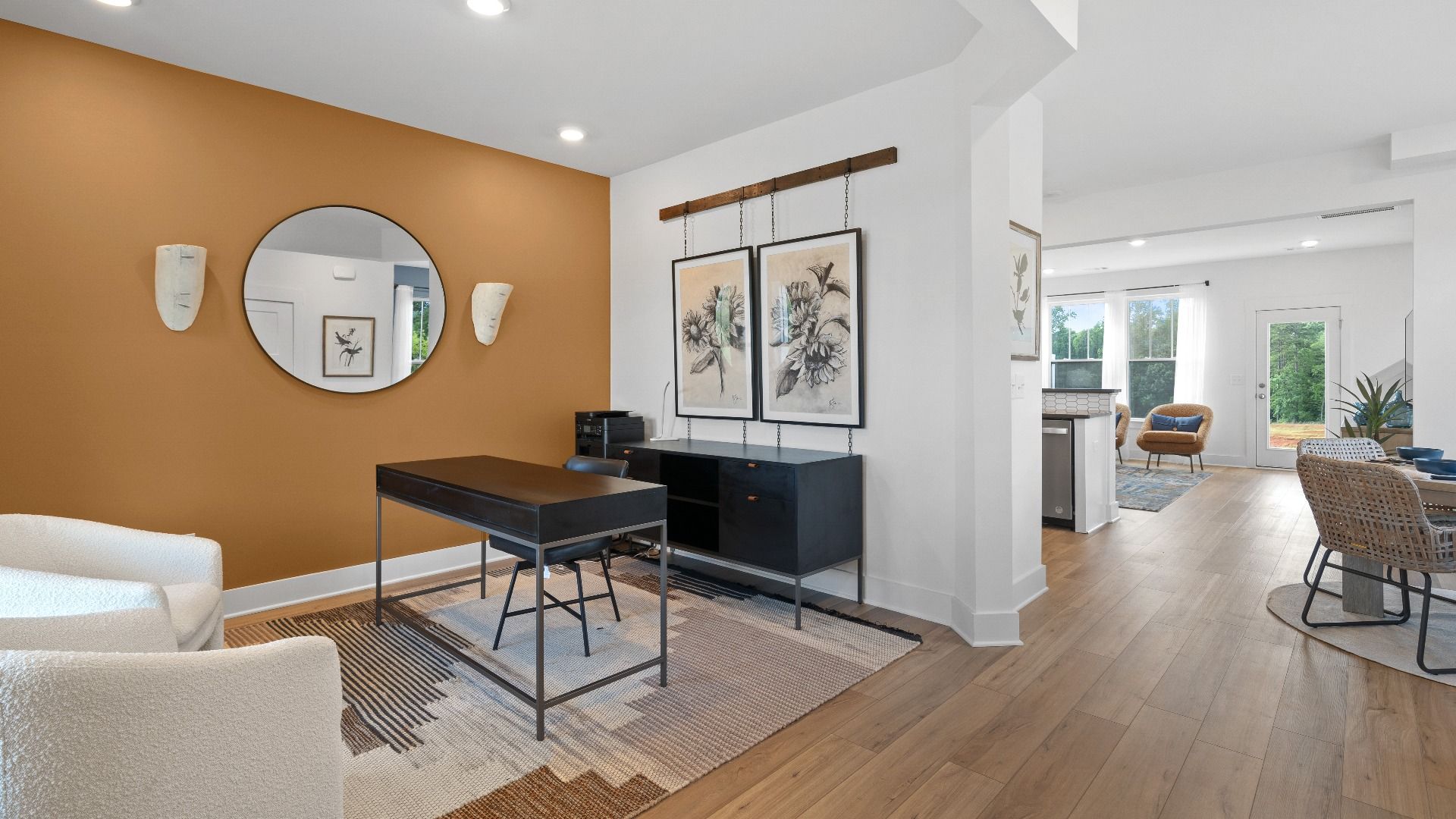 Eye-catching flex room with elegant millwork and seamless access to dining and kitchen at Clarke Townes