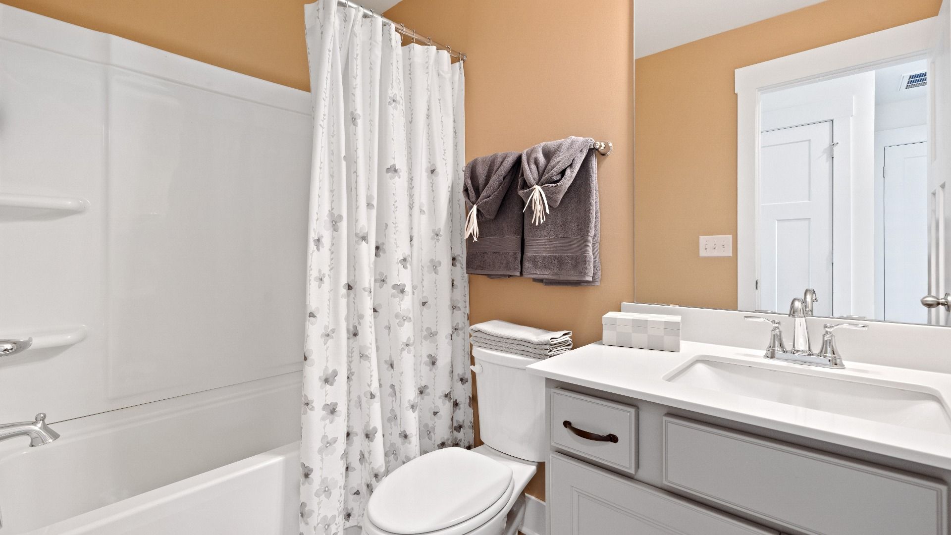 Elegant bath retreat of The Churchill Design with designer finishes and a clean, timeless aesthetic