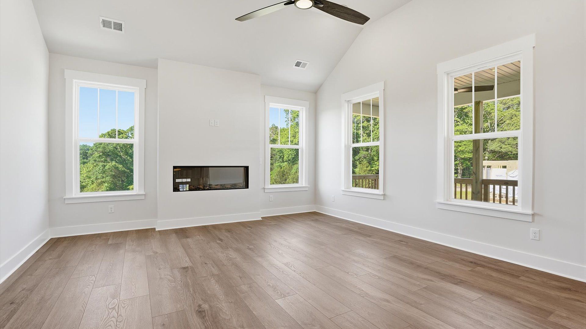 Tasteful family room with two-story volume, refined finishes, and exceptional natural light located in Woodruff, SC
