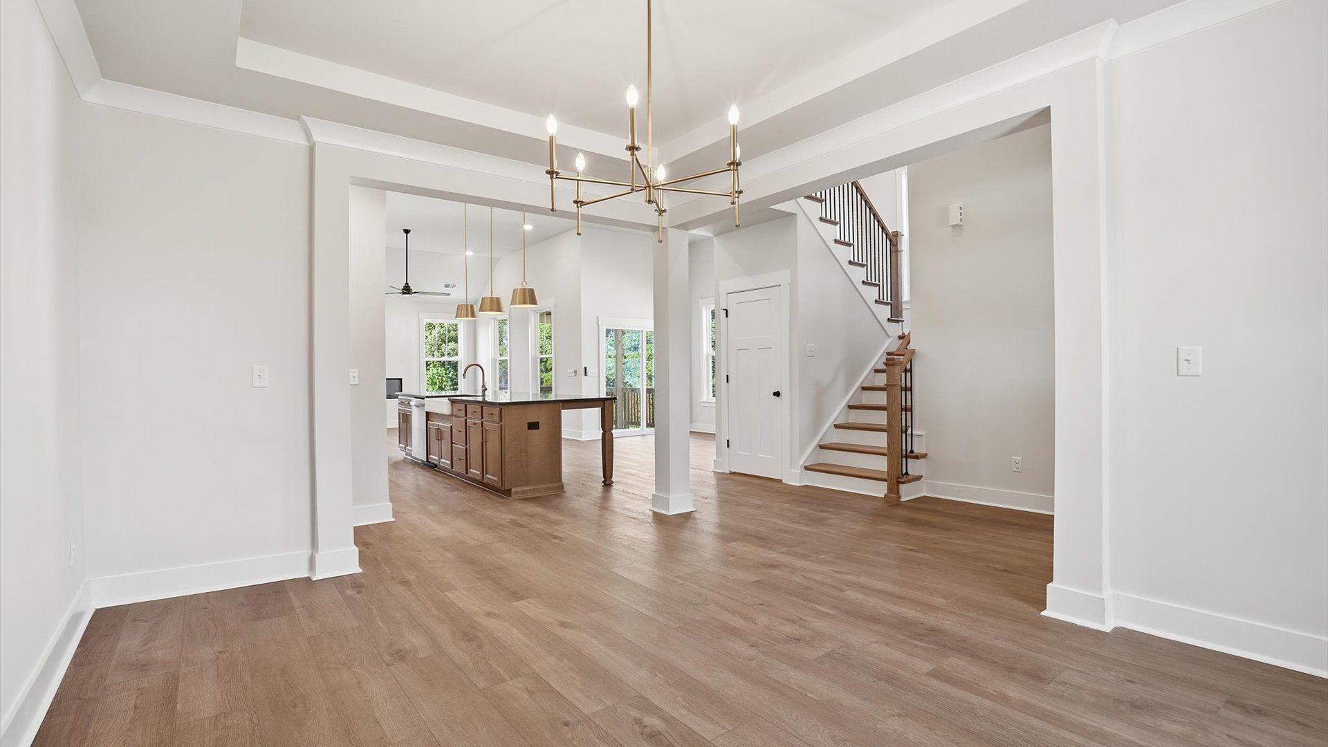 Modern layout with classic touches like a tray ceiling in this select Pinebrook community home
