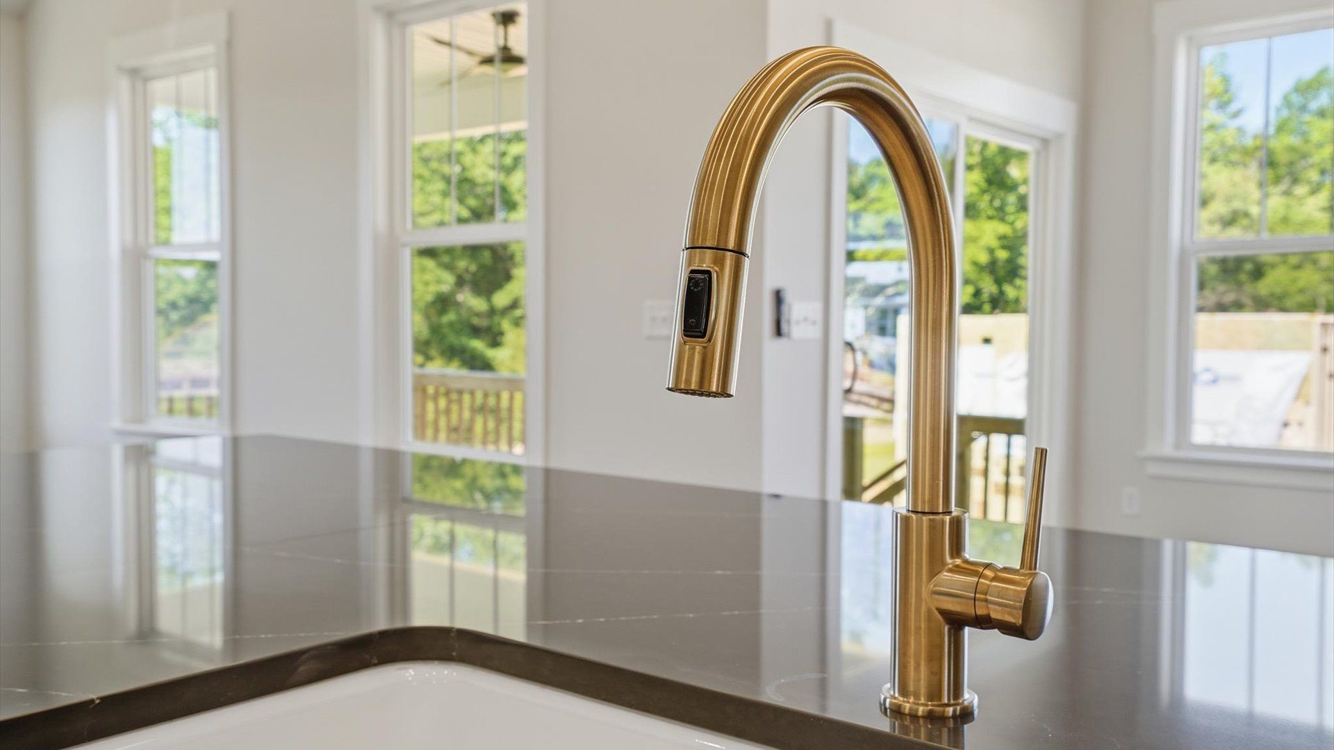Highly skilled design choices create a clean, open kitchen with a central island located at the Pinebrook community