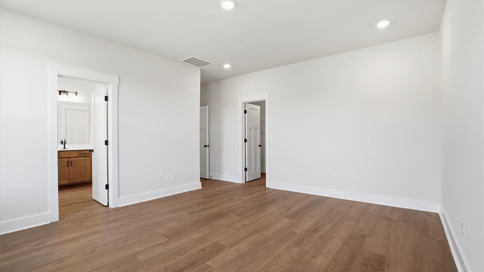 Eye-catching details and elegant finishes in the vibrant primary suite of this select home located in Woodruff, SC