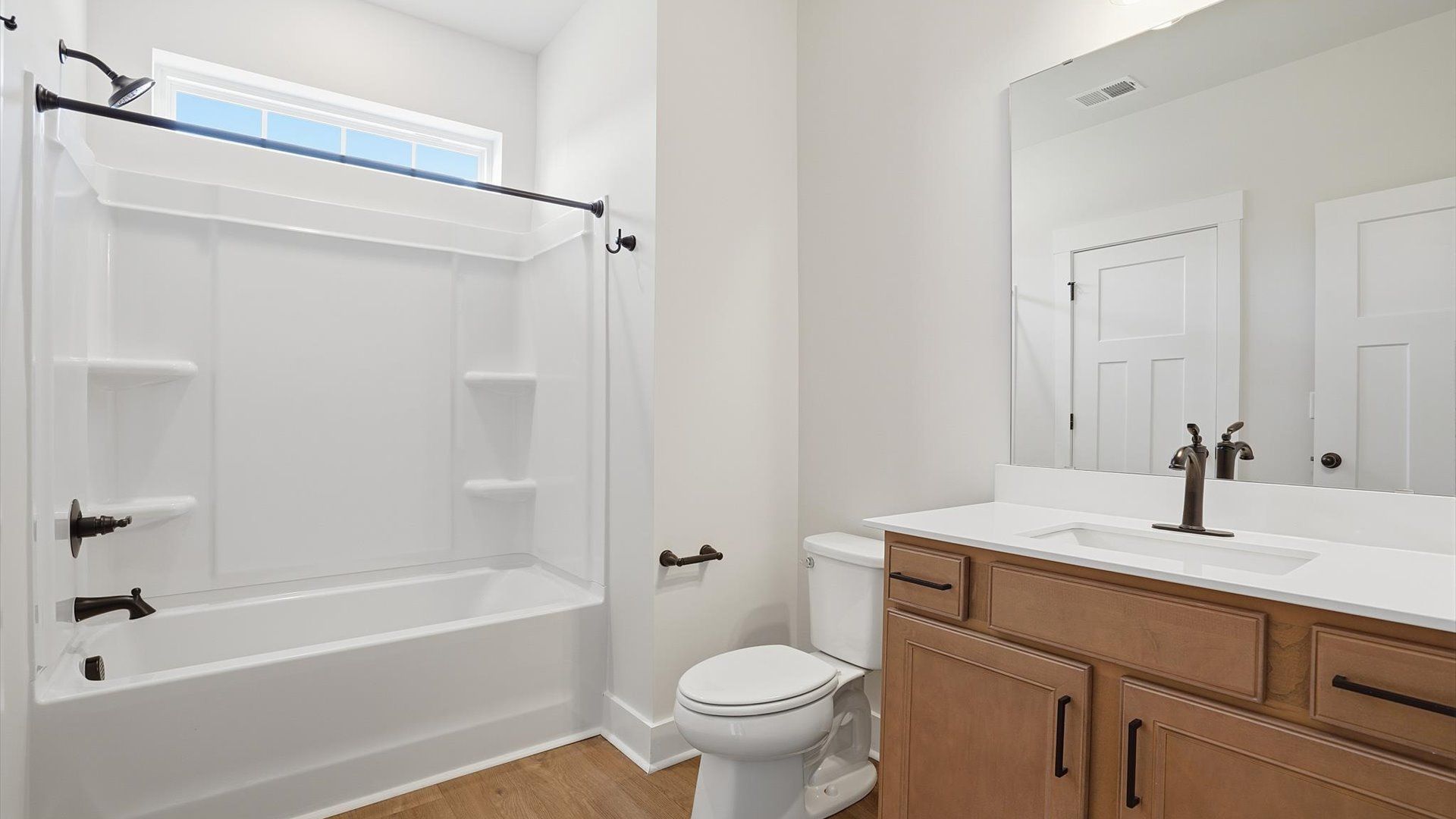 Top-notch bathroom with current fixtures, tasteful materials, and elevated charm at the Pinebrook community