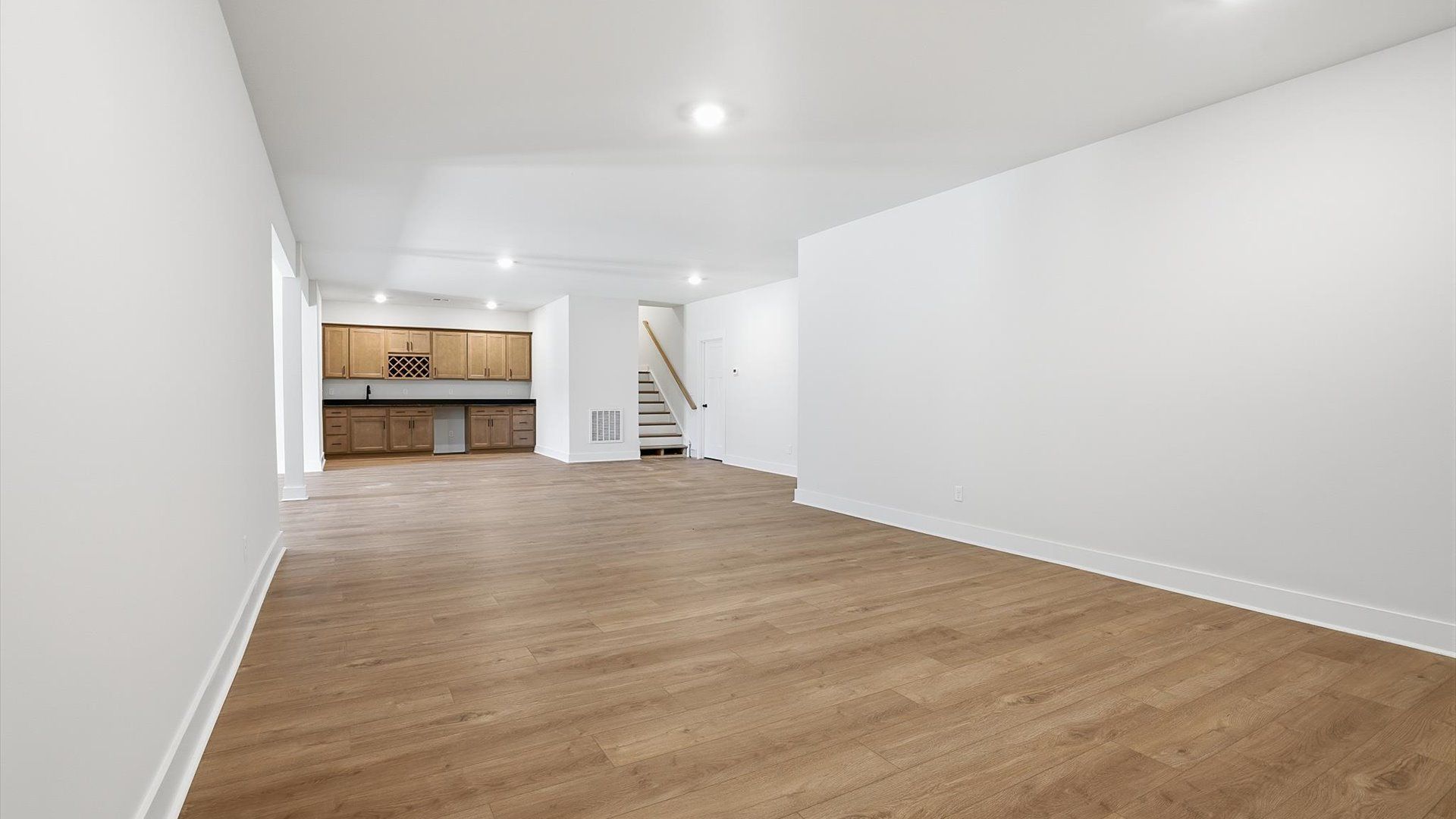 Finished basement living area offering comfort, flexibility, and space to gather located at the Pinebrook community