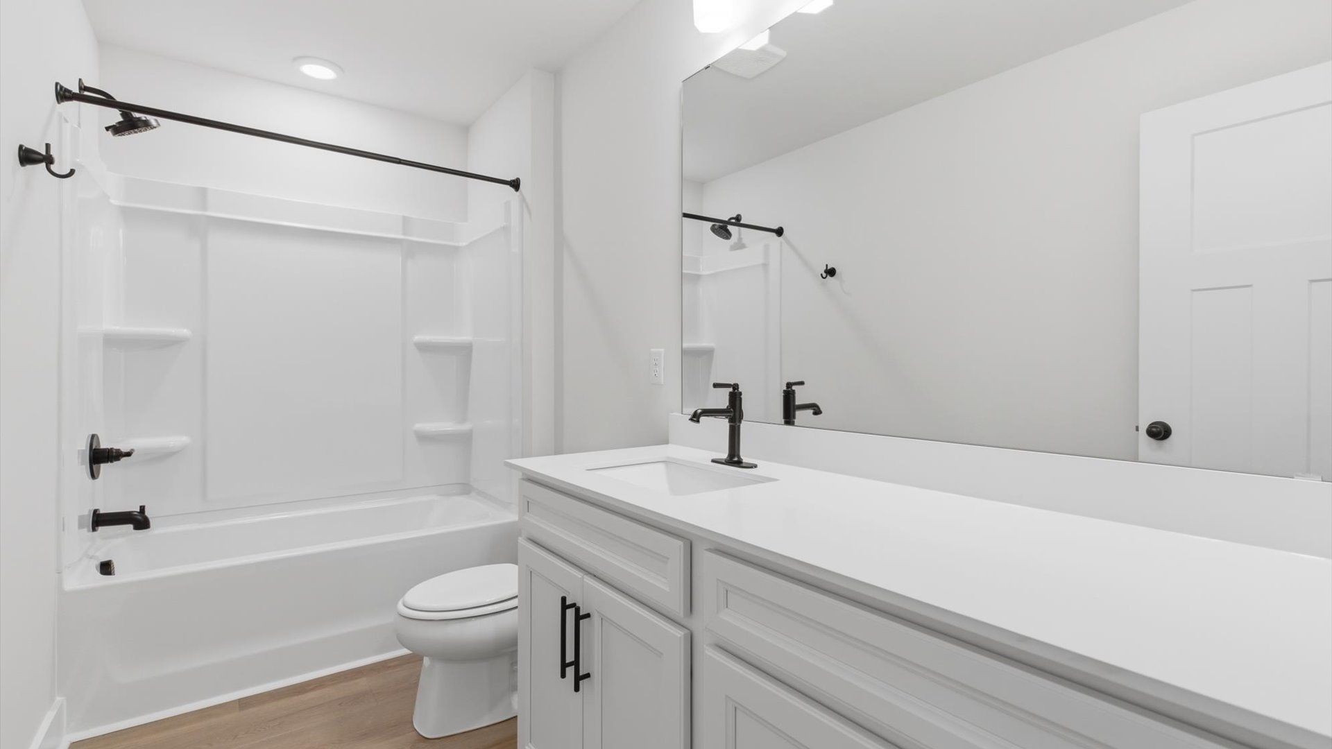 Stylish guest bathroom with superior design and thoughtful storage solutions located at Pelham Crossing
