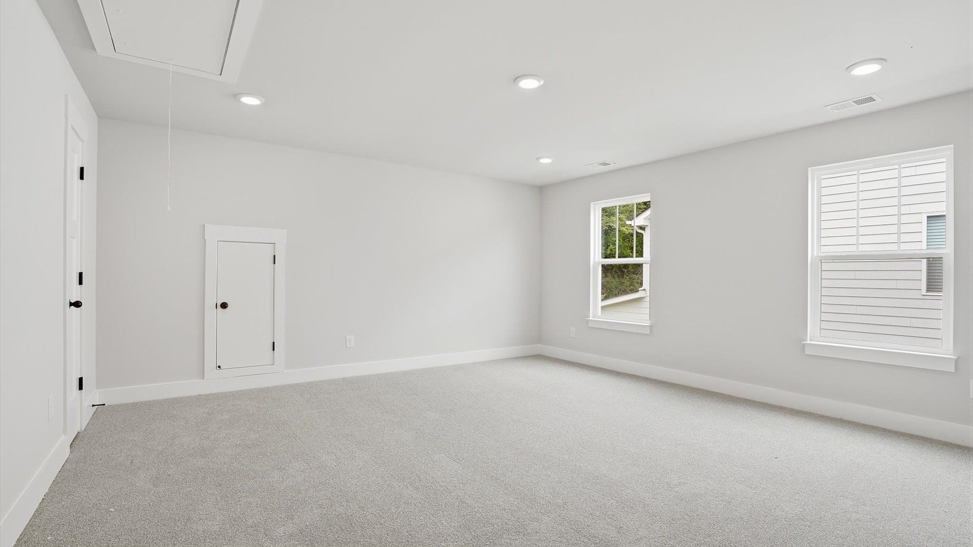 Top-notch design defines this bonus room with carpeted floors and an open, airy layout located at Creeks at Midway