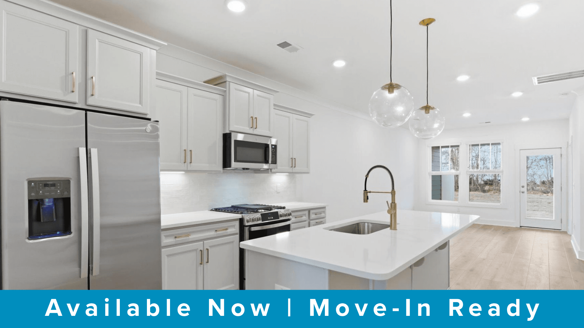 First-rate kitchen with functional layout, designer pendant lighting, and a large center island