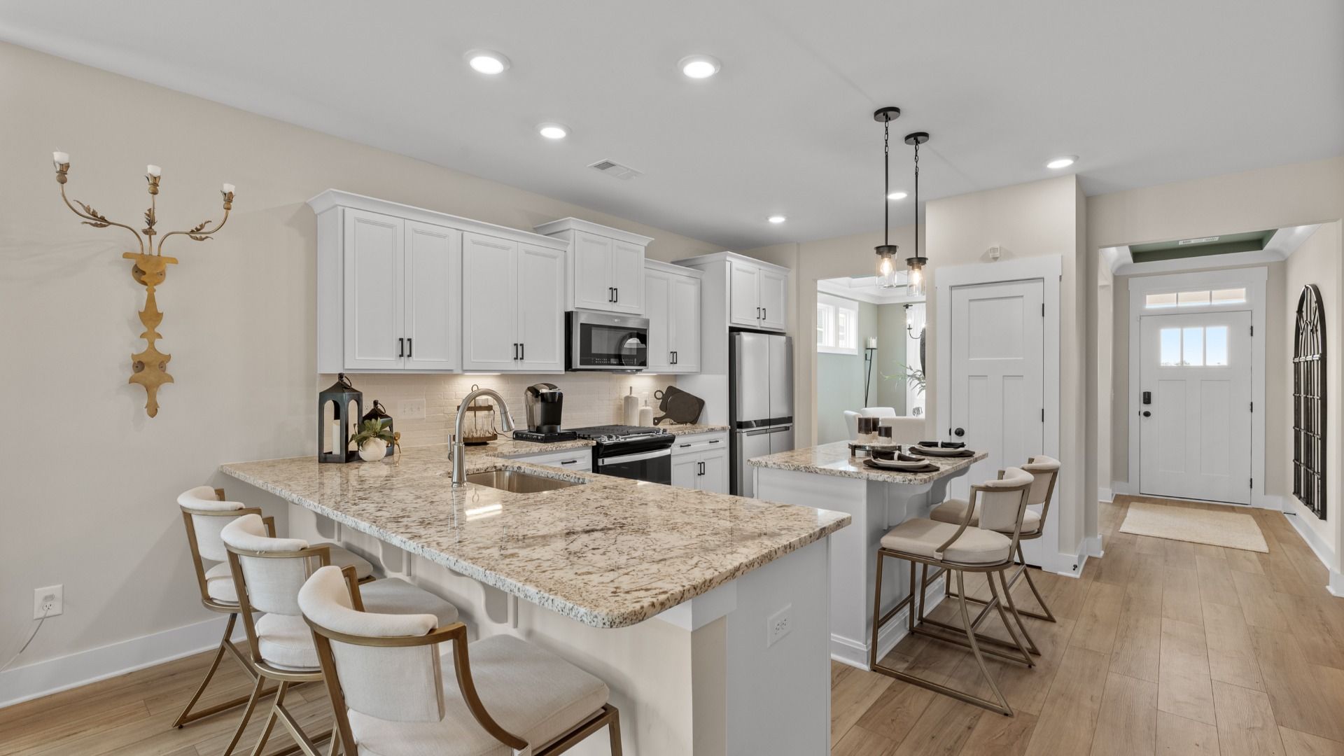 Exclusive DRB Homes kitchen with a center island, elevated finishes, and pendant lighting in a prime location
