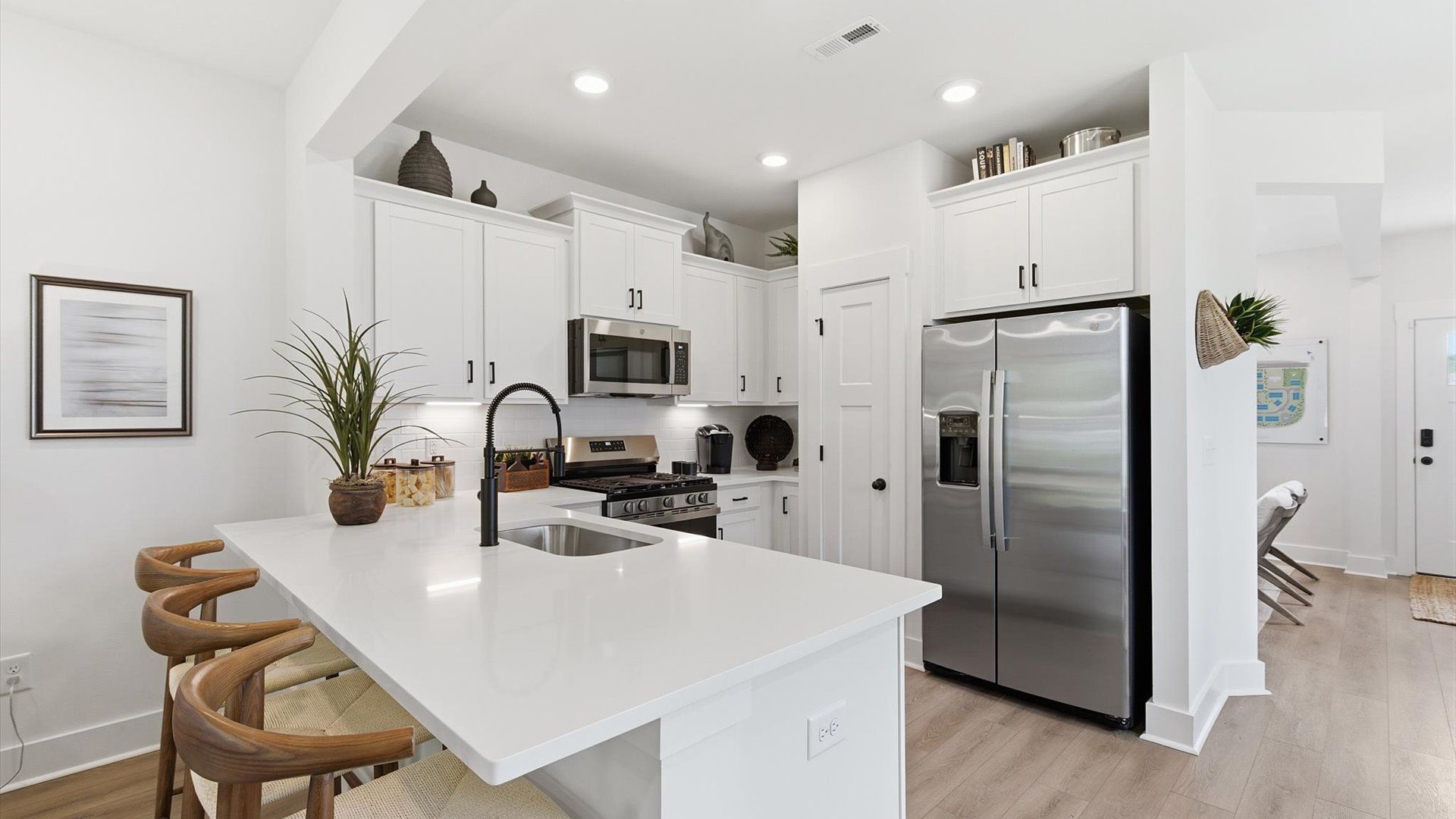 Superior craftsmanship shines in this modern kitchen with an open flow and tasteful decor at this villa in Clarke Townes