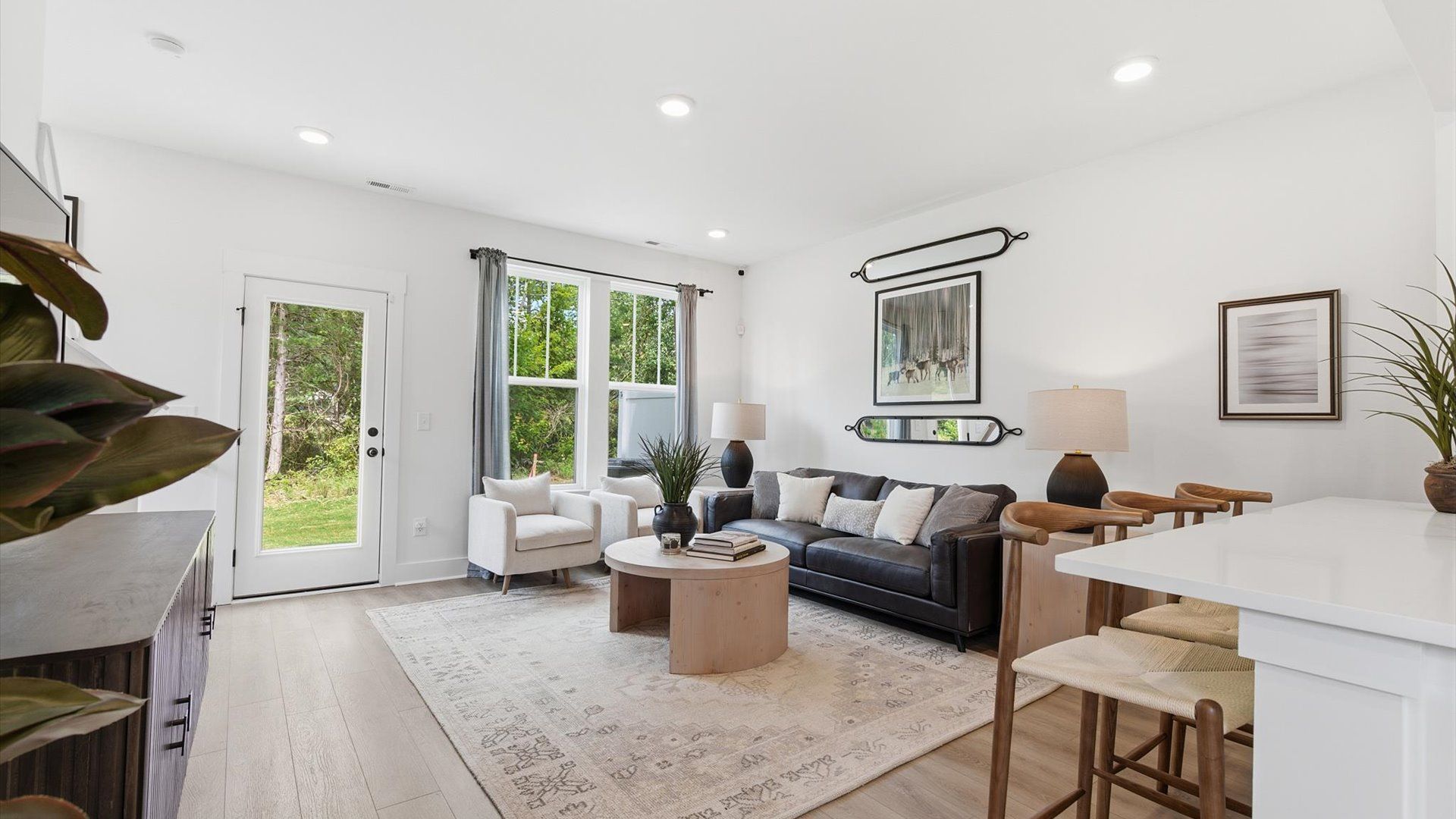 Notable family room designed with high standards—perfect for both everyday living and entertaining at Clarke Townes community