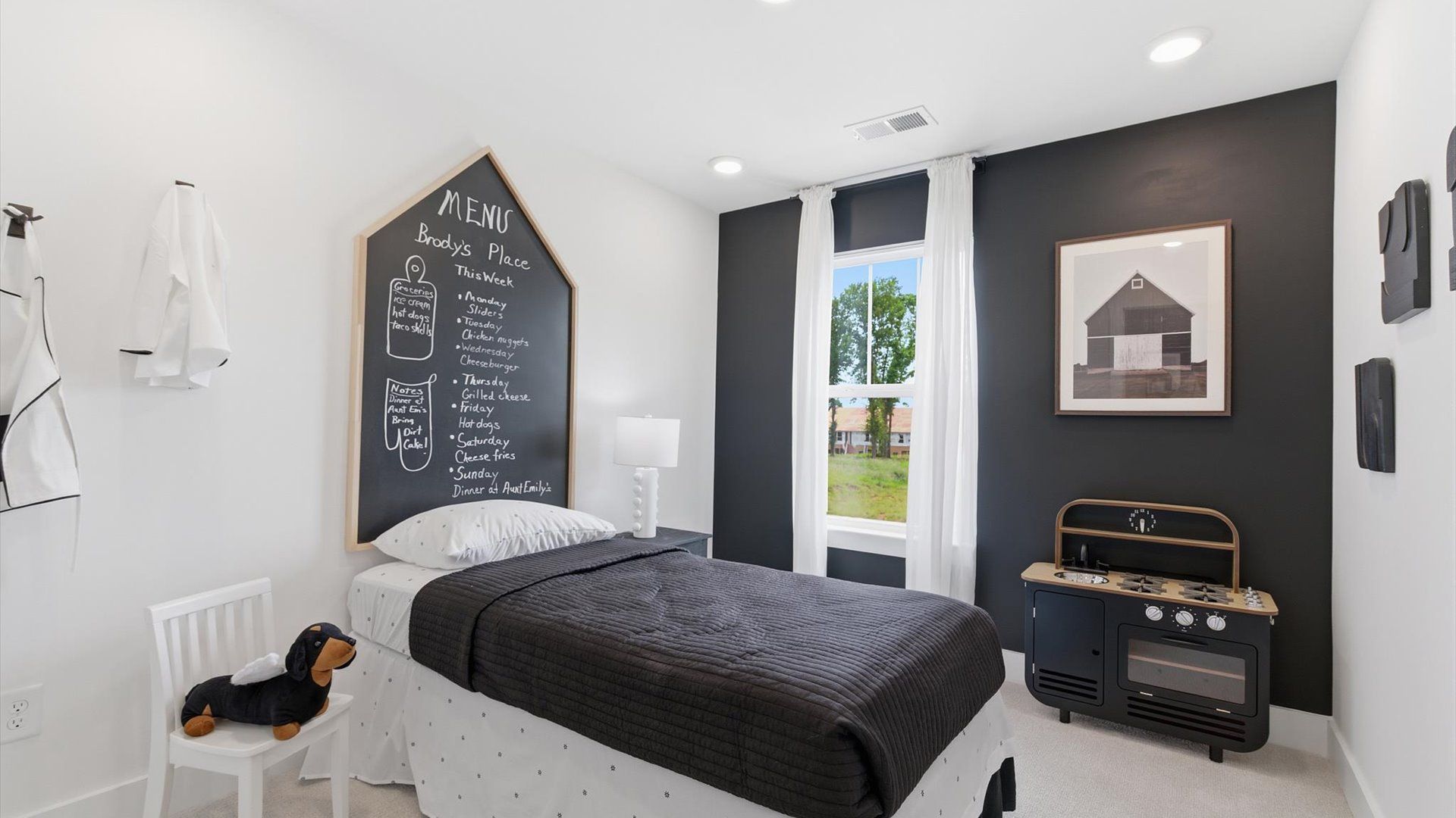 Inviting bedroom with tasteful finishes and a large window that creates a fresh, open ambiance at this villa in Anderson, SC