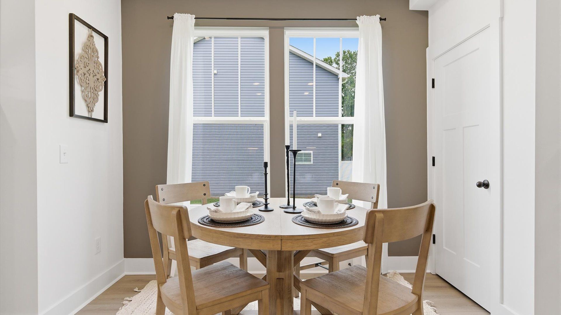 Inviting breakfast area with a seamless connection to the kitchen for everyday living at the Churchill Design
