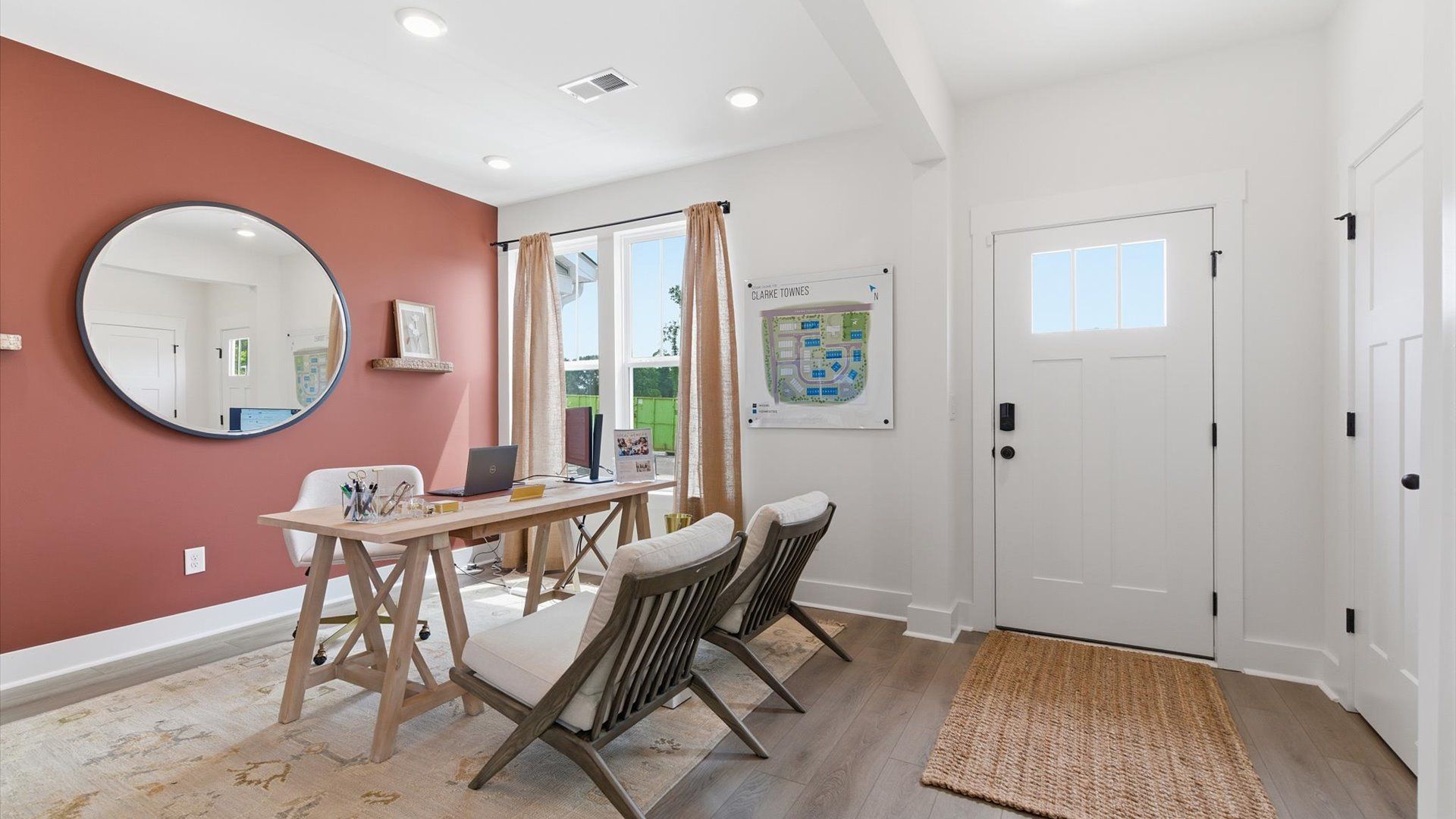 Accomplished hardwood flooring foyer sets the tone for tasteful design throughout the home at the Churchill Design