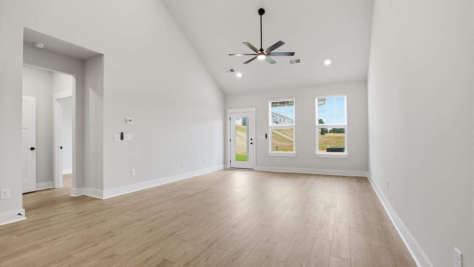 Spacious and stylish family room with two-story ceilings that create a bright and open atmosphere in Anderson, SC