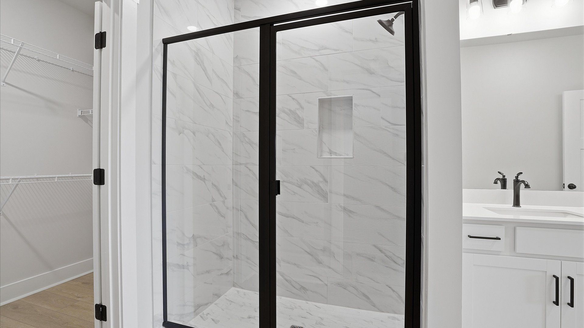 Notable primary suite with dual vanities and walk-in shower in this prime Anderson villa