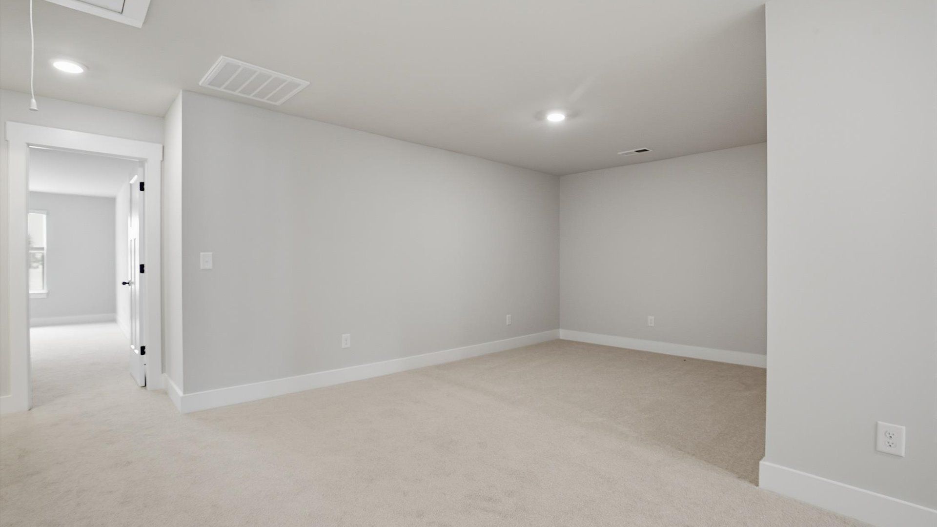 Refined loft with comfortable carpeted flooring and tasteful design throughout at the Silo Ridge community
