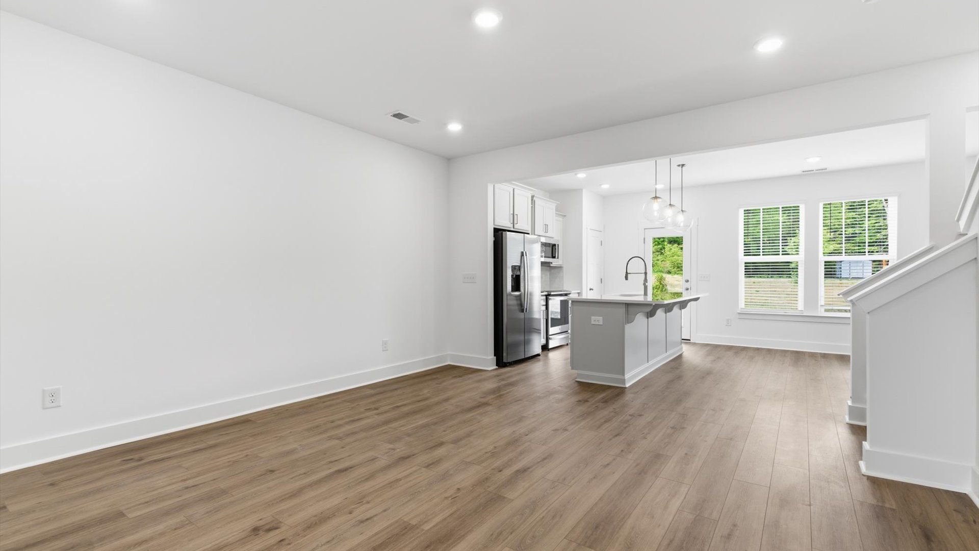 Hardwood flooring and high standards define this vibrant family room ideal for everyday living